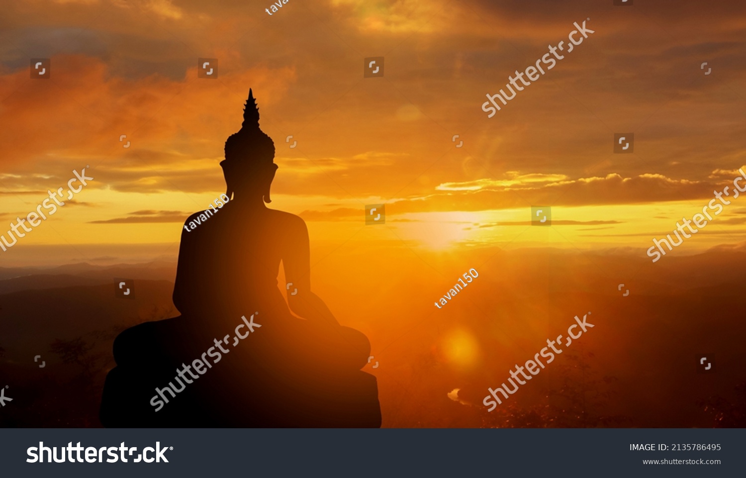 buddha silhouette on golden sunset background beliefs of Buddhism #2135786495