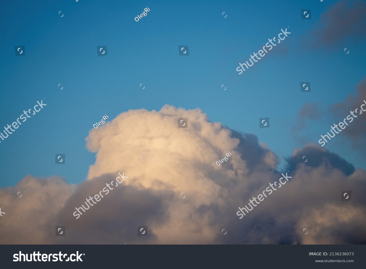 Puffy white cloud on clear blue sky #2136236073