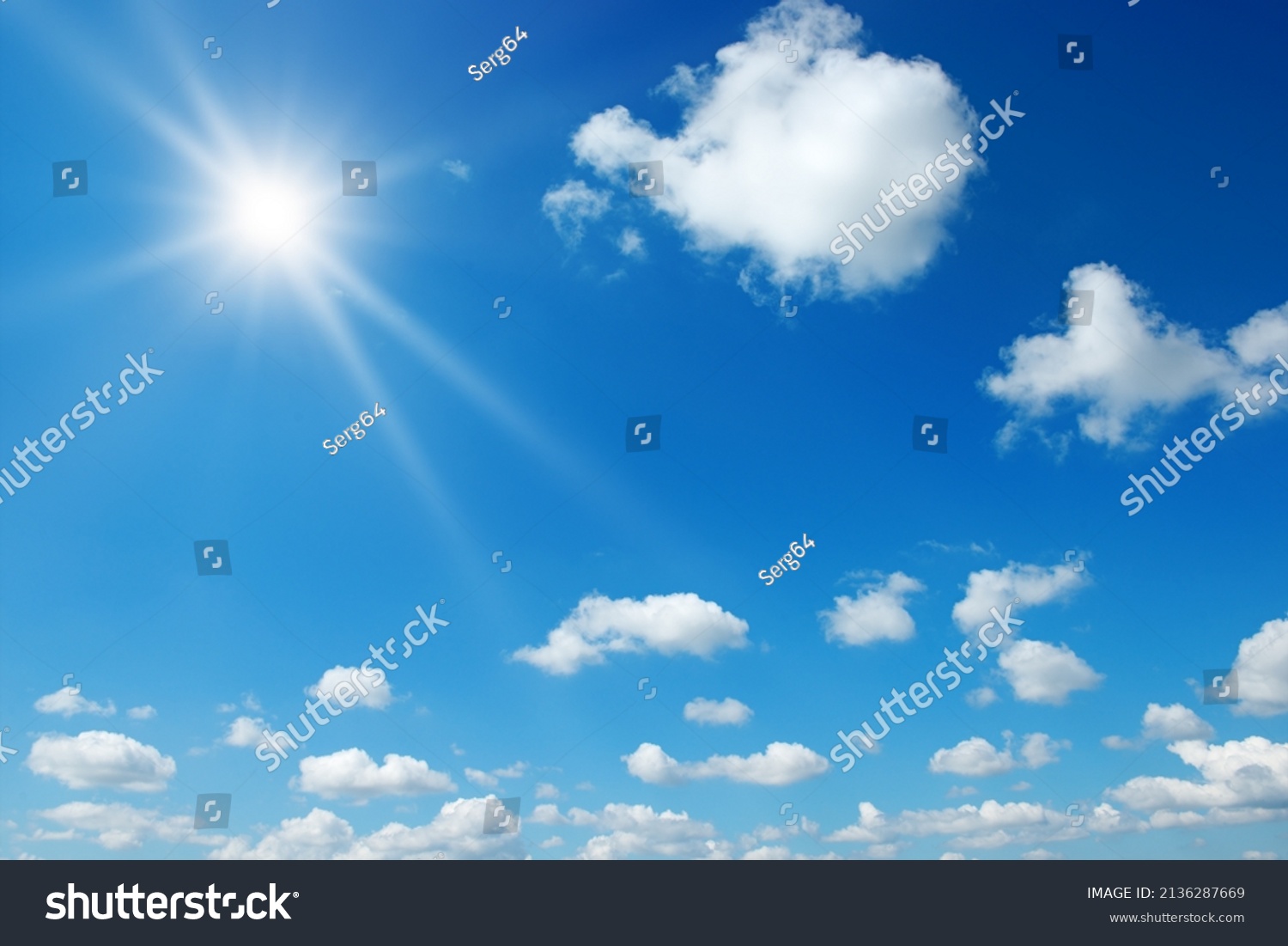 Bright sun on beautiful blue sky with white fluffy clouds. #2136287669