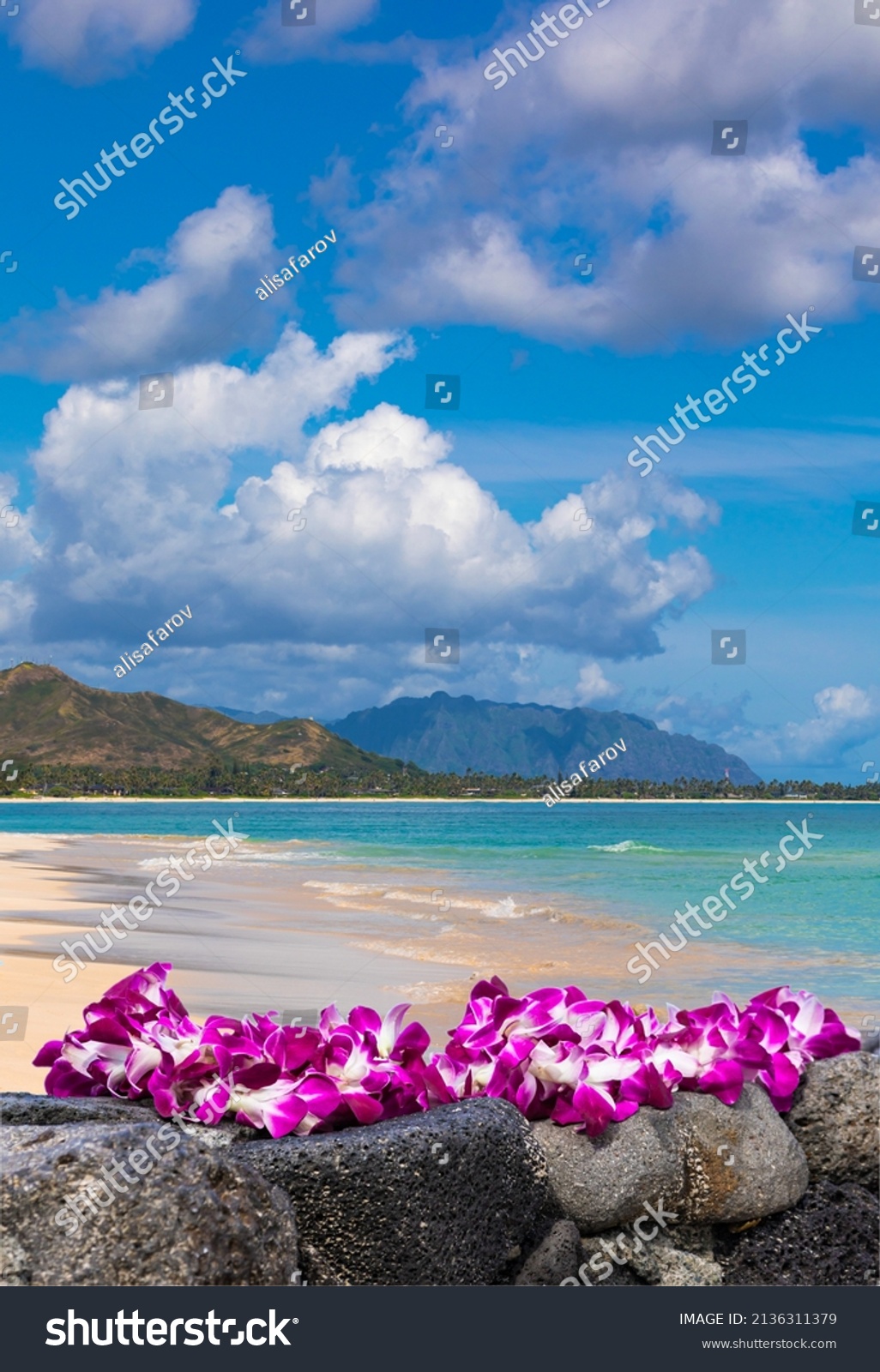 Fresh Lei Flowers Necklace on the beach, Oahu Hawaiian Island Tropical Vacation Background. Hawaii Luau Icon Travel Concept. Selective focus. #2136311379