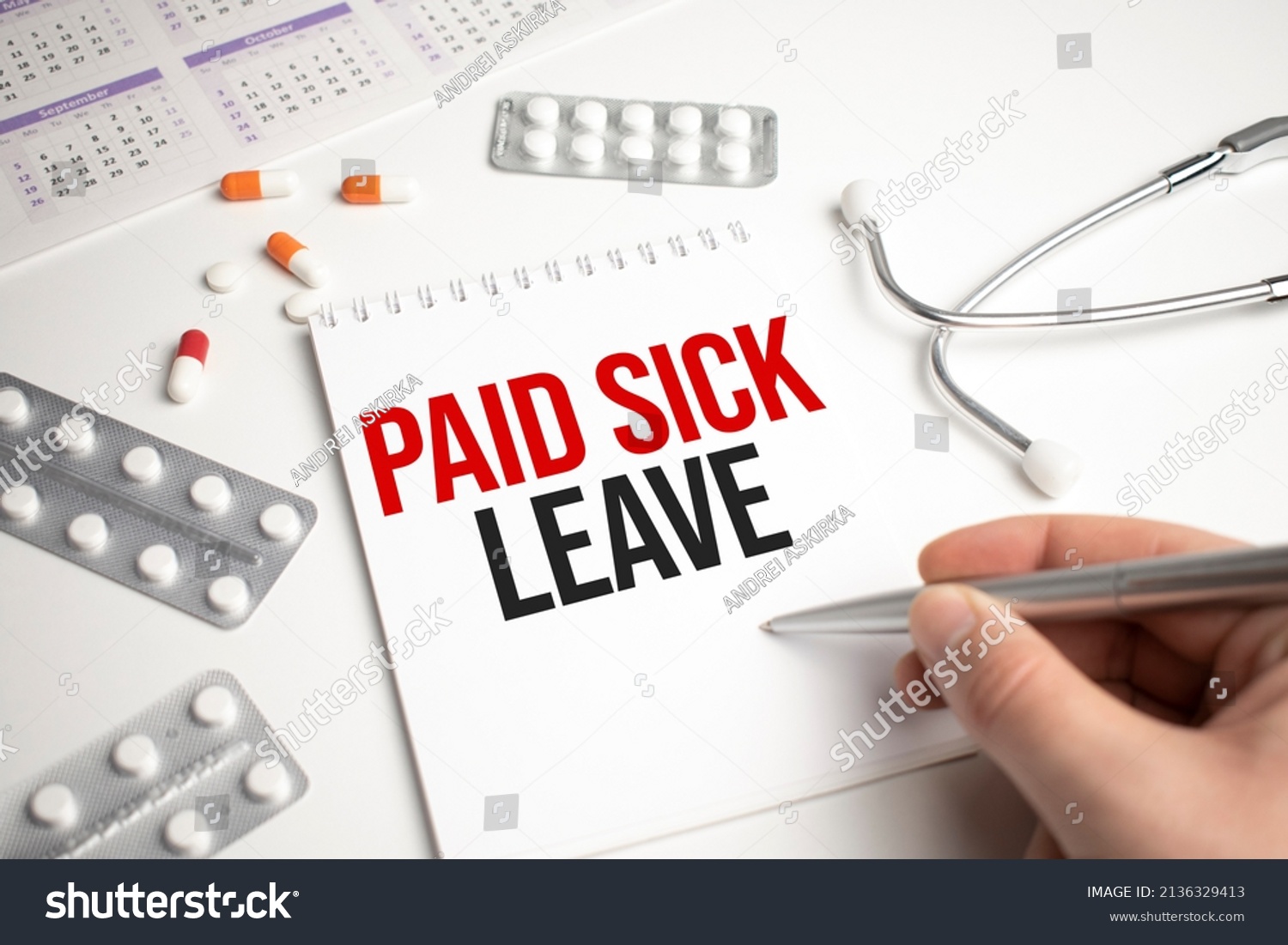 Pills, covid test and a medical phonendoscope with the inscription paid sick leave on a blue background. FMLA Family Medical Leave Act #2136329413