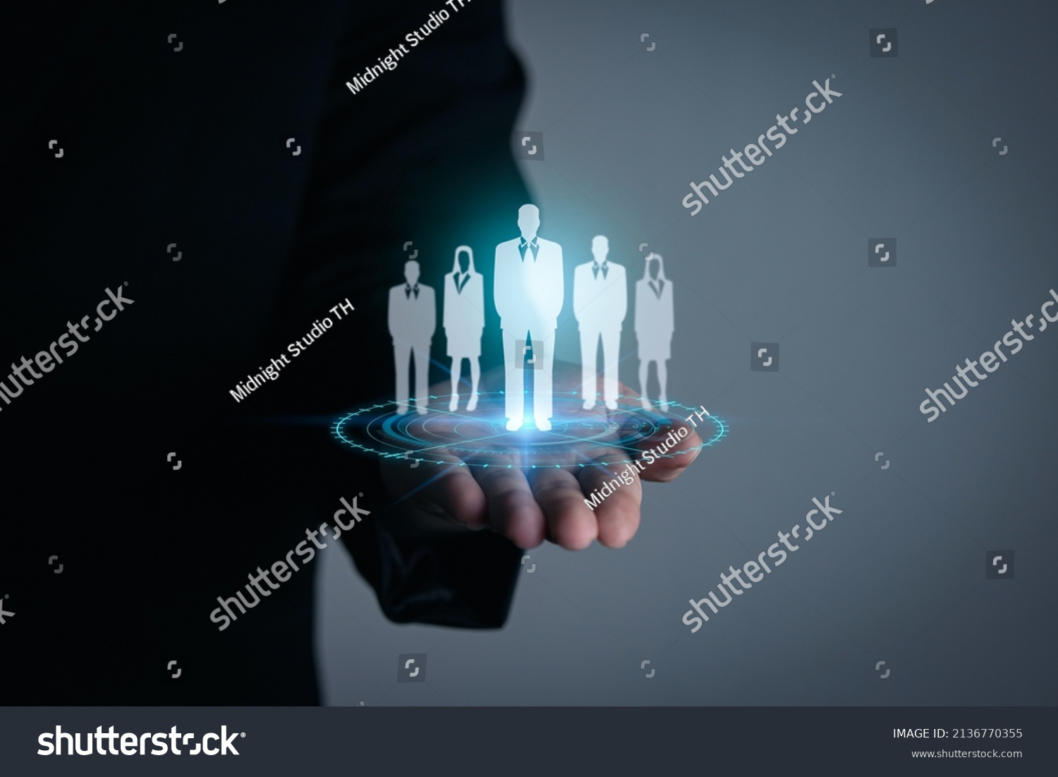 Personnel recruitment concept, job placement, strategic planning for personnel management and teamwork for success. businessman hand holding virtual businessman icon #2136770355