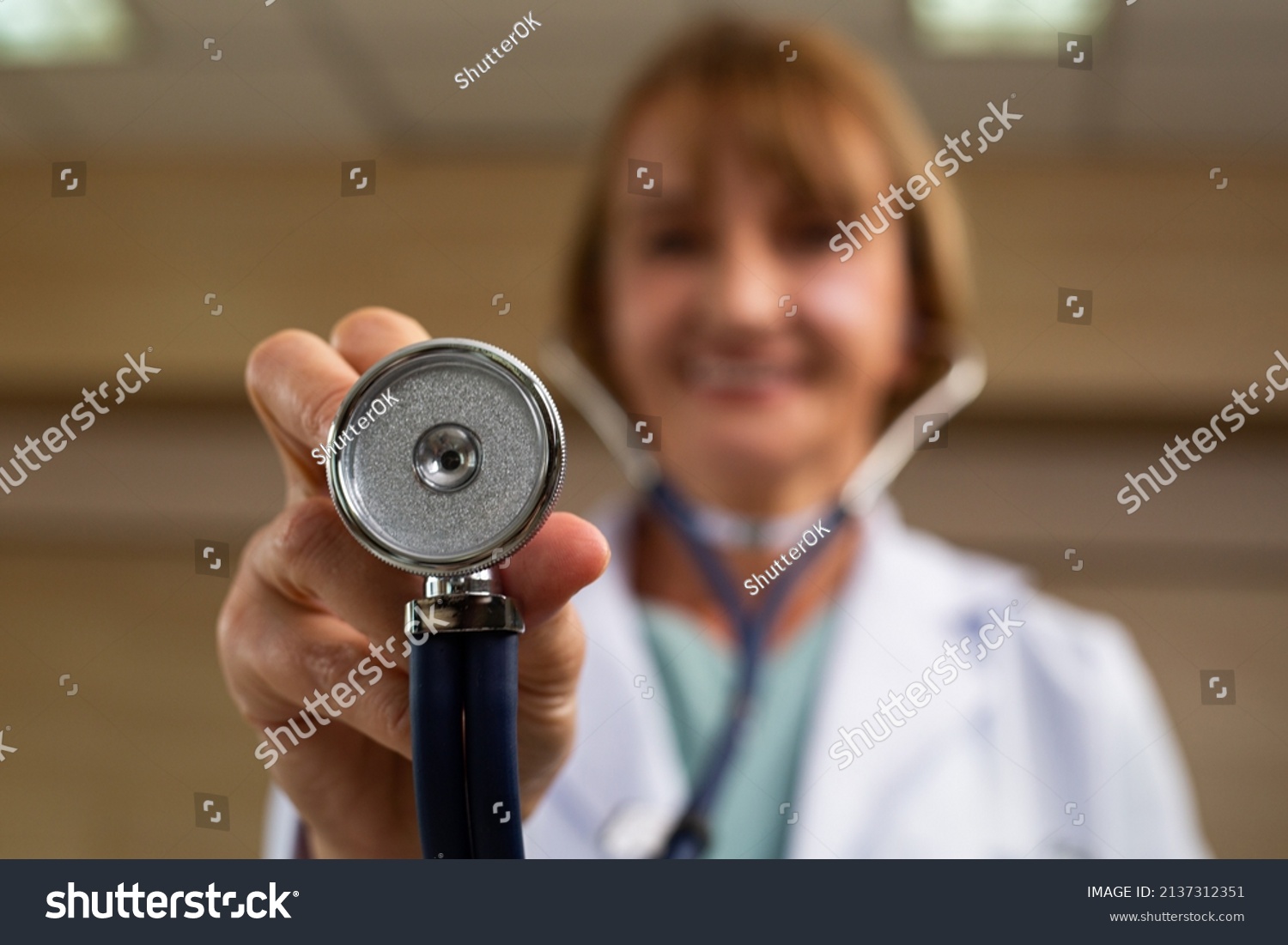 Medicare doctor holding stethoscope for support patient person in hospital. #2137312351