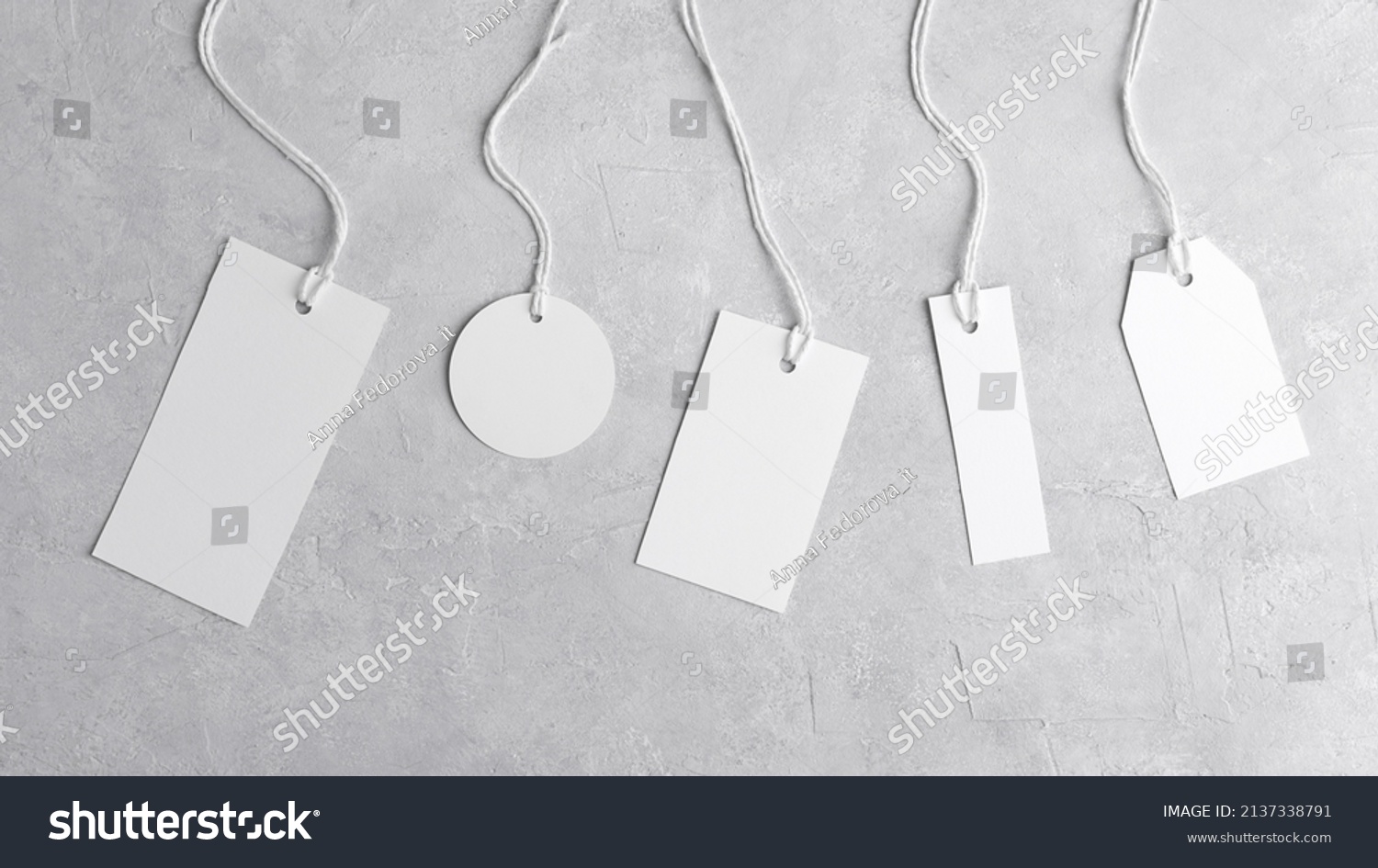 Round tag mockup, rectangle tag mockup, strip tag mockup with white cord, close up. Various price cardboard labels on grey background. Blank empty paper product tags, sale and black friday concept #2137338791