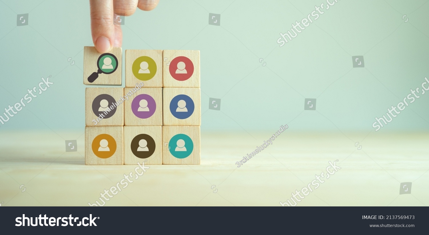 Buyer persona and target customer concept. Customer psychology profile or characteristics. Personalized marketing. Customer analysis for marketing plan. Hand holds wood cubes with buyer persona icons. #2137569473