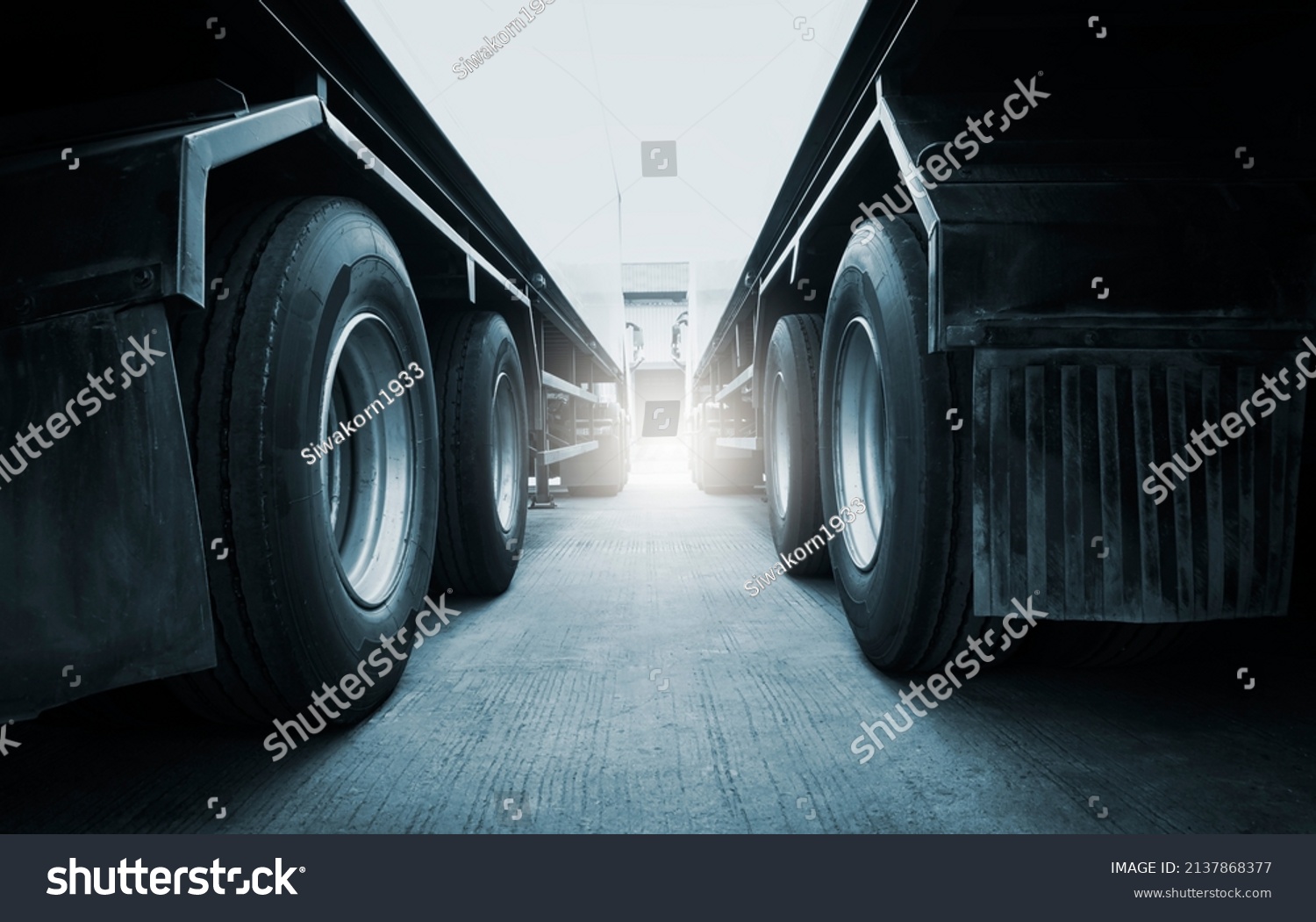 Semi Trailer Trucks on Parking  at Warehouse. Big Rig Semi Truck Wheels Tires. Auto Service Shop. Shipping Trucks. Lorry Tractor. Industry Freight Truck Logistics Cargo Transport.	 #2137868377