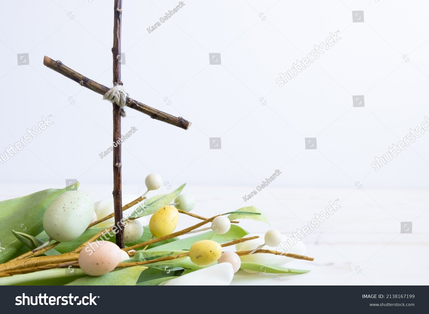Christian cross with white tulips and easter eggs #2138167199