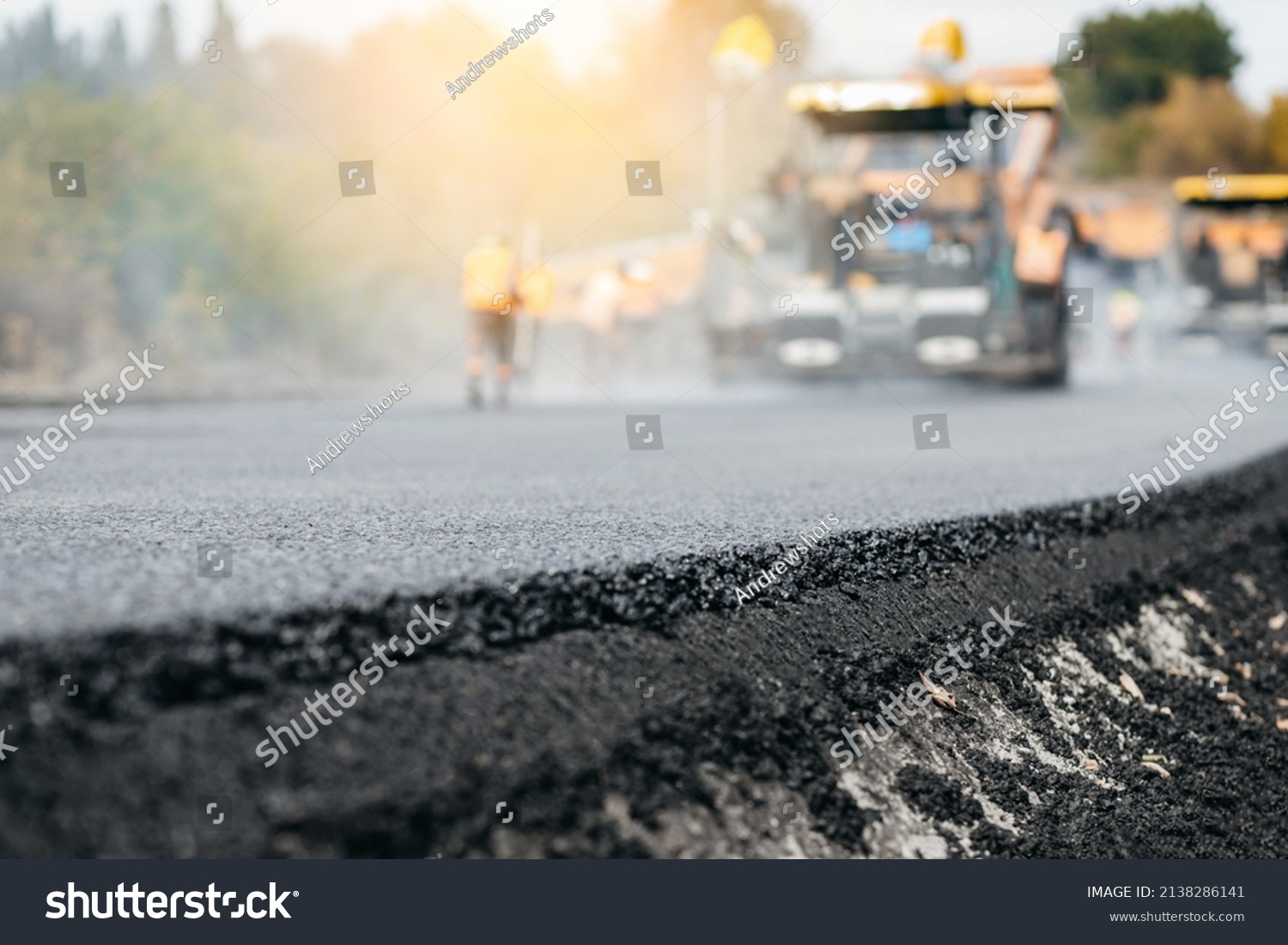 Vibratory asphalt rollers compactor compacting new asphalt pavement. Road service repairs the highway #2138286141