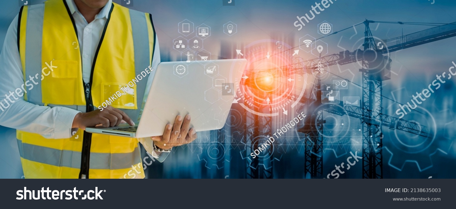 Double exposure engineering working with digital technology interfaces icon and construction cranes on city background, Smart industry and digital technology and IOT software concept. #2138635003