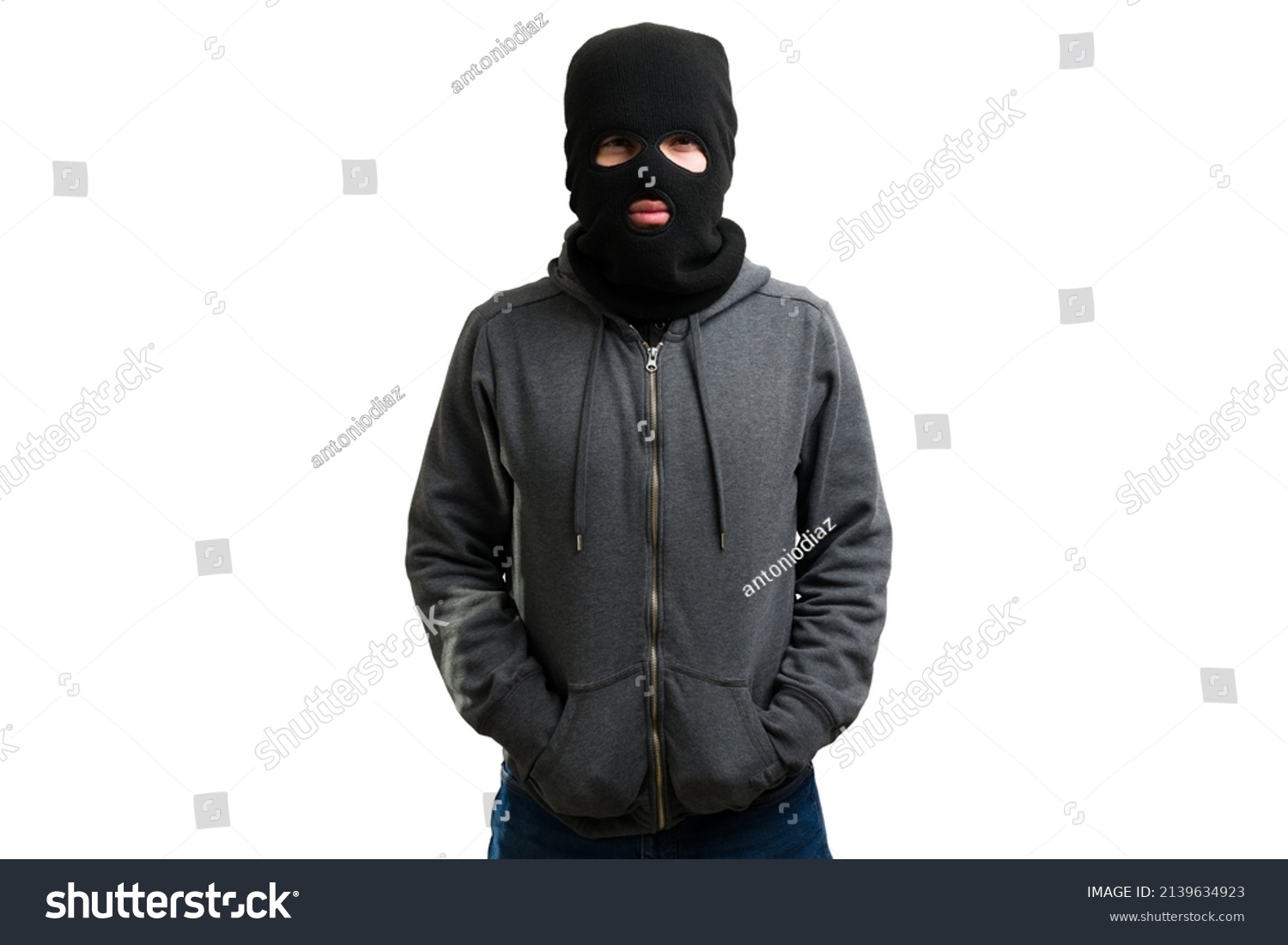 Studio shot of a masked unrecognizable young man wearing a black balaclava  #2139634923