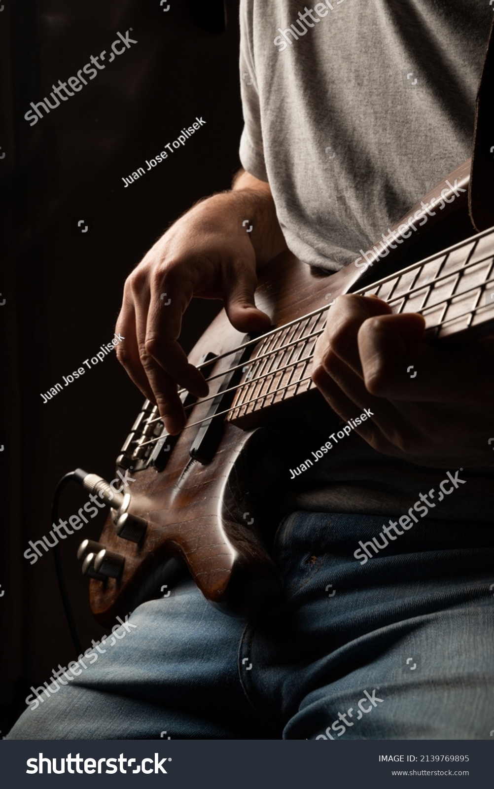 
playing the bass, bass and guitar lessons #2139769895