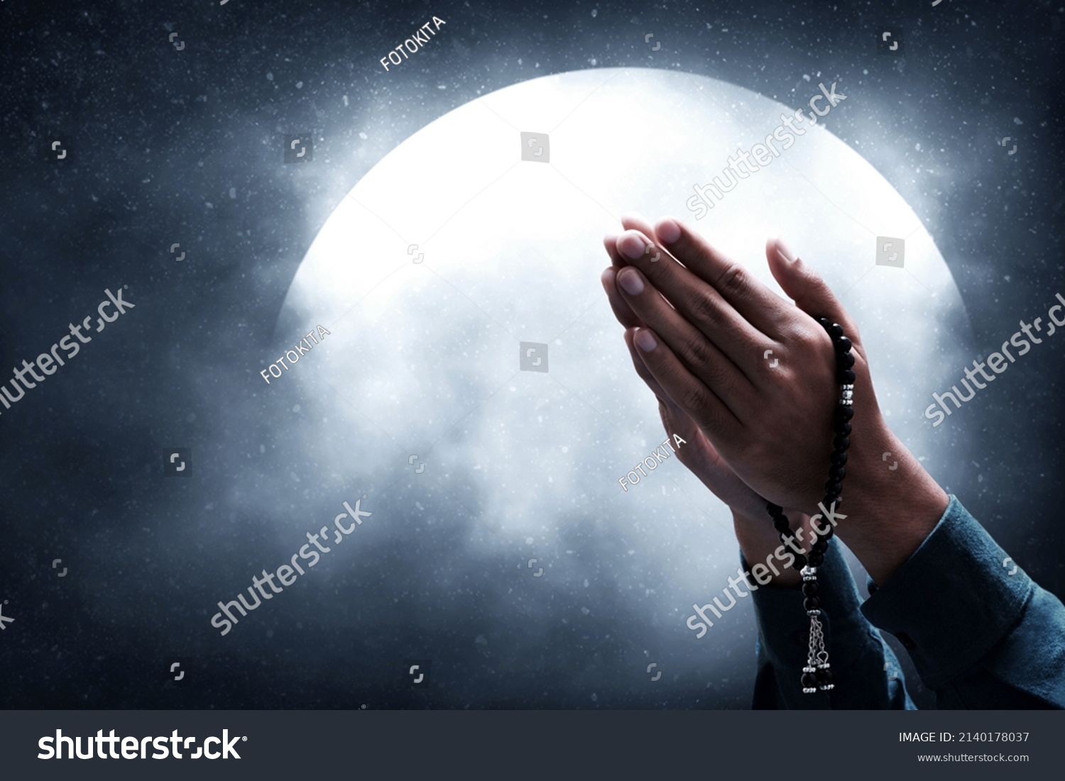 Muslim man praying on night sky moon #2140178037