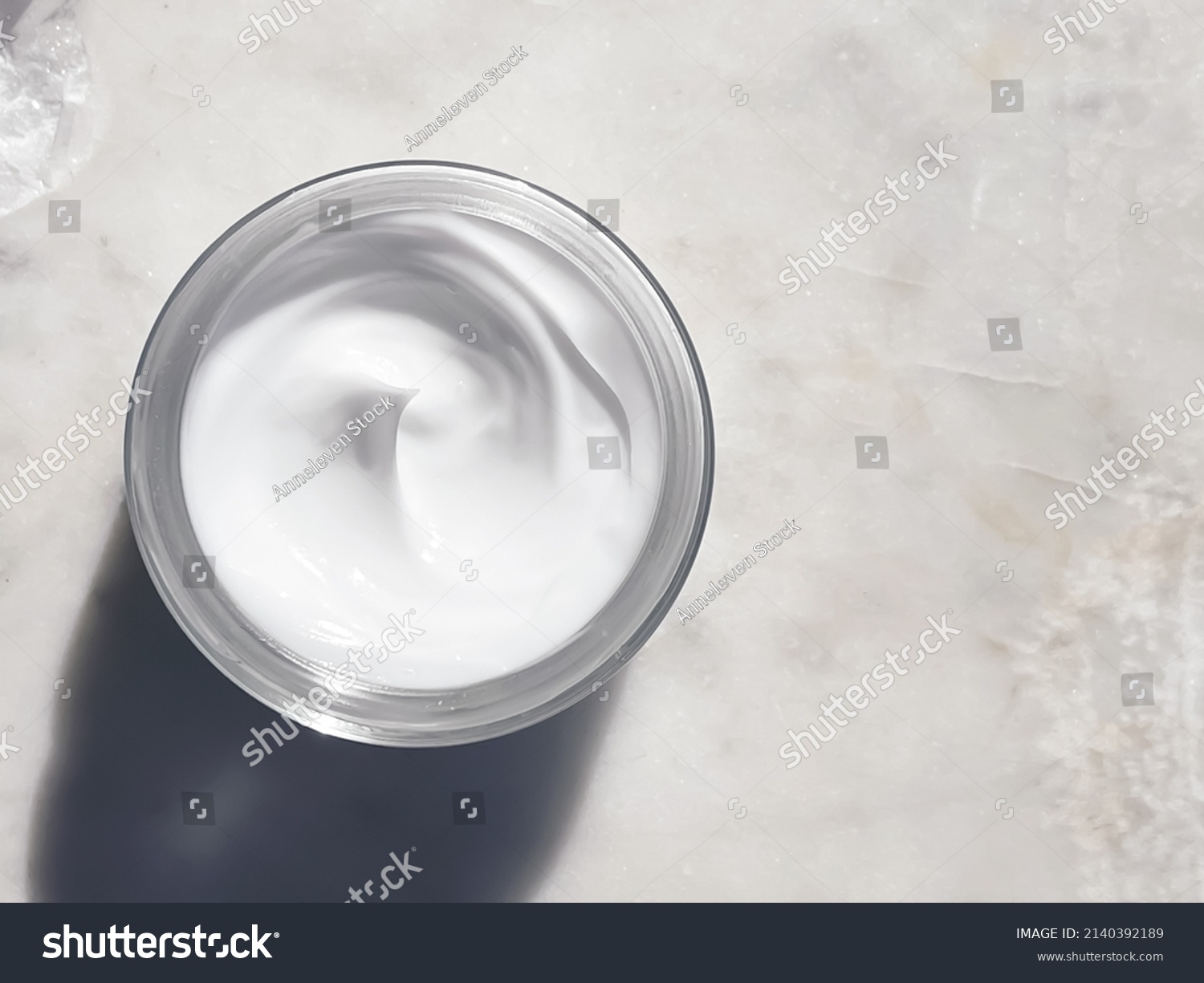 Face cream moisturiser, glass jar on marble stone background, skincare and cosmetic, beauty product concept #2140392189