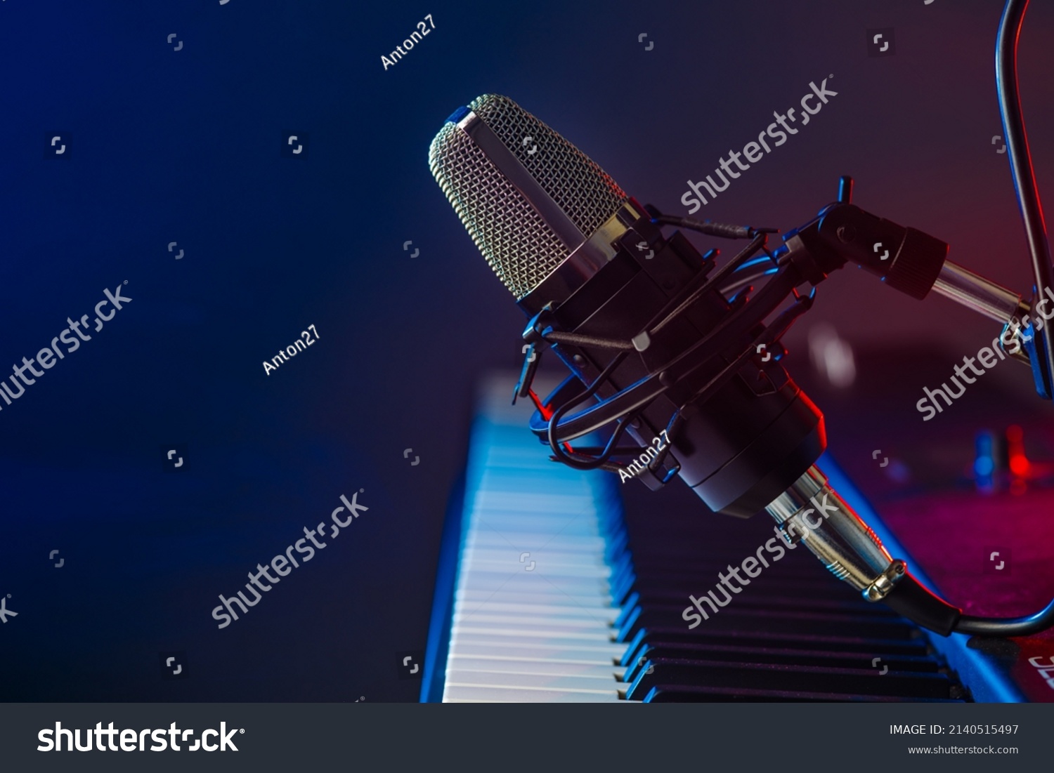 Musical instrument - midi keyboard and microphone on a blue background. Electronic equipment, recording studio, vocals, music, music video, music album recording. Banner, poster, invitation. #2140515497