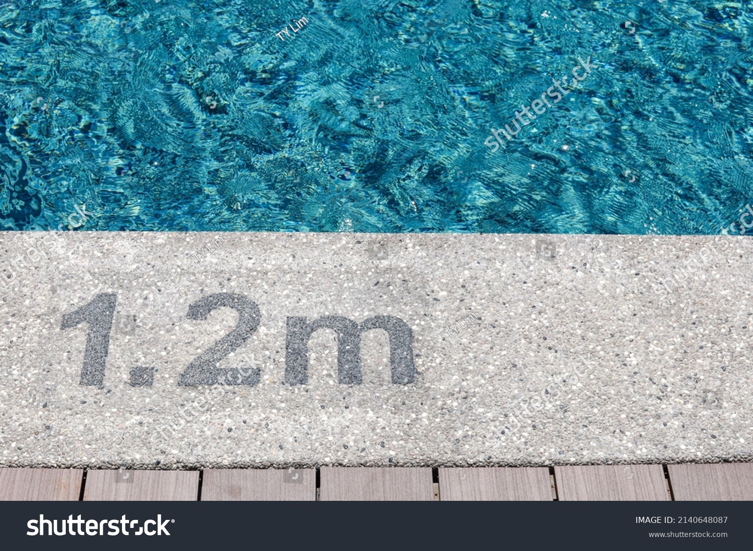 Pool depth warning sign on swimming poll side. Showing swimming pool depth of 1.2 meter. #2140648087