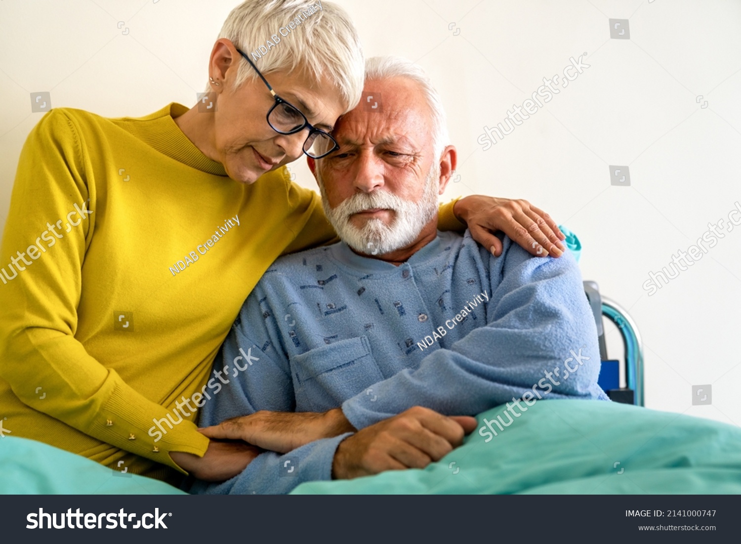 Senior woman with seriously ill husband in hospital. Healthcare support anxiety love concept #2141000747
