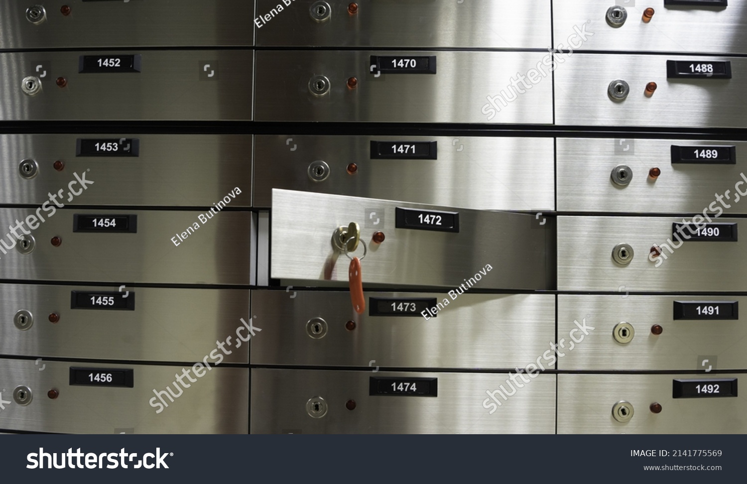 Safe deposit boxes inside bank vault. Open deposit box with key #2141775569