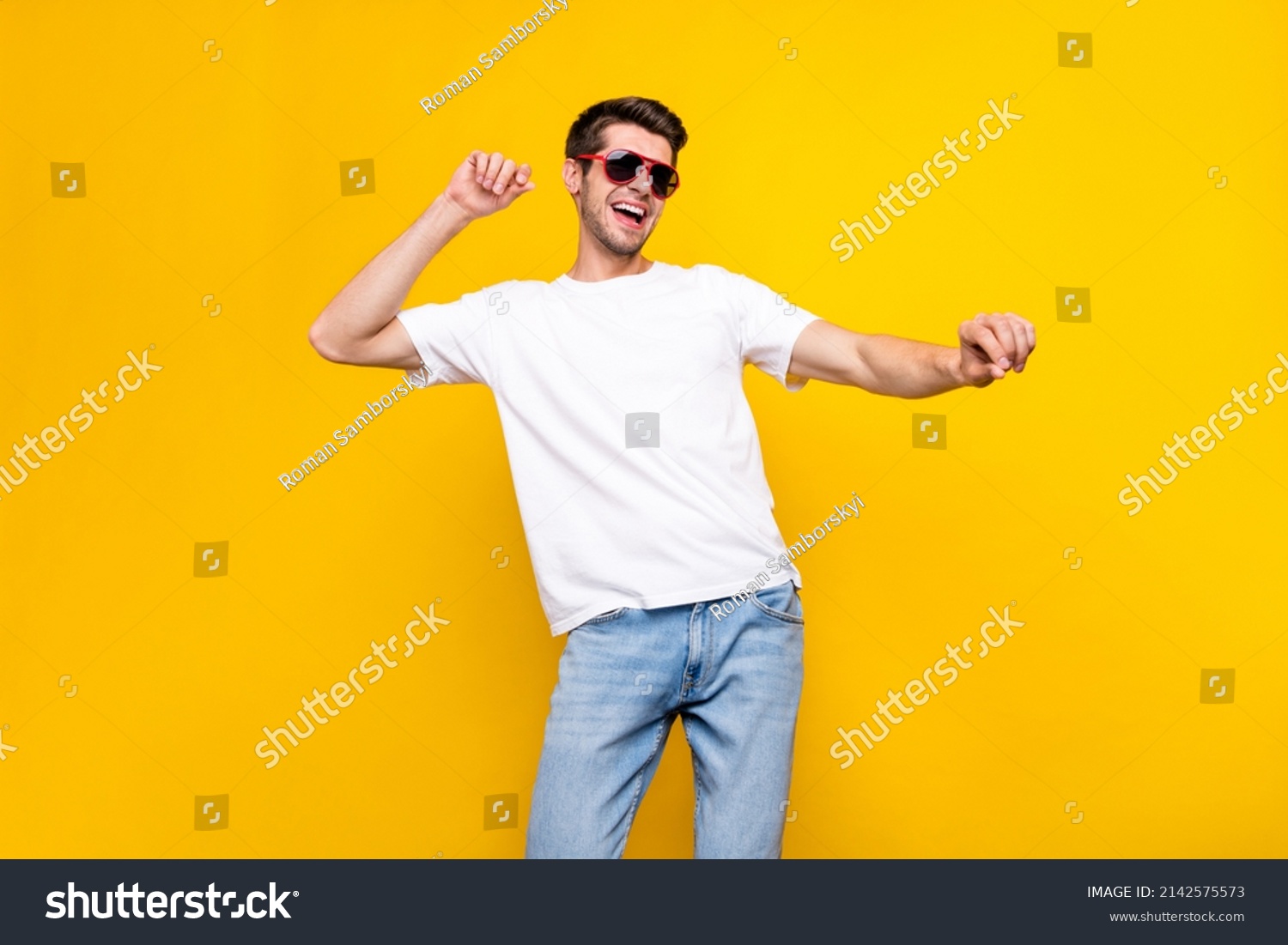 Photo of cool young brunet guy dance wear glasses t-shirt isolated on yellow color background #2142575573