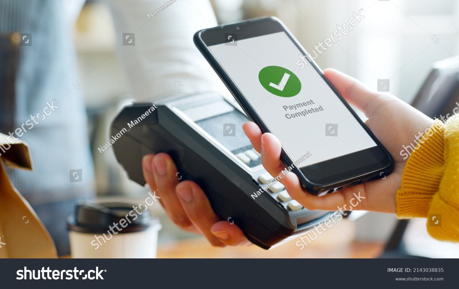 Customer using smartphone for NFC payment at cafe restaurant, cashless, contactless technology and money transfer concept #2143038835