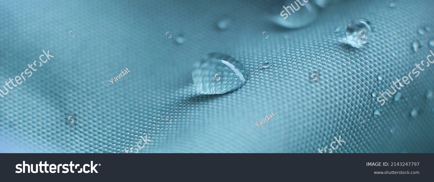 waterproof fabric with waterdrops. non woven fabric water texture background Water drops on waterproof nylon fabric. soft focus #2143247797