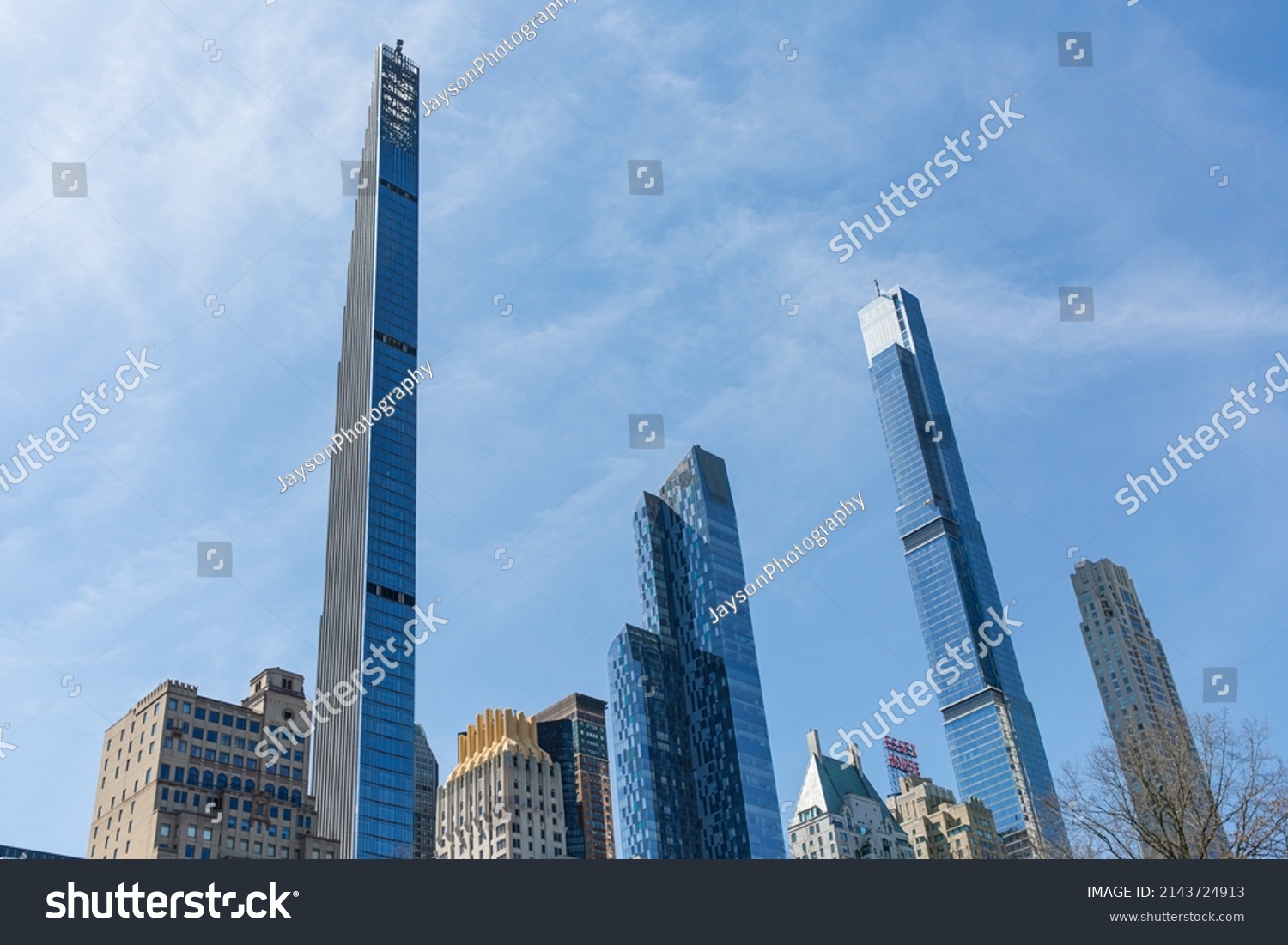 New York city, USA - April 2nd 2022: Steinway tower with Central park tower and other buildings at Manhattan.  Low angle view from central park. #2143724913