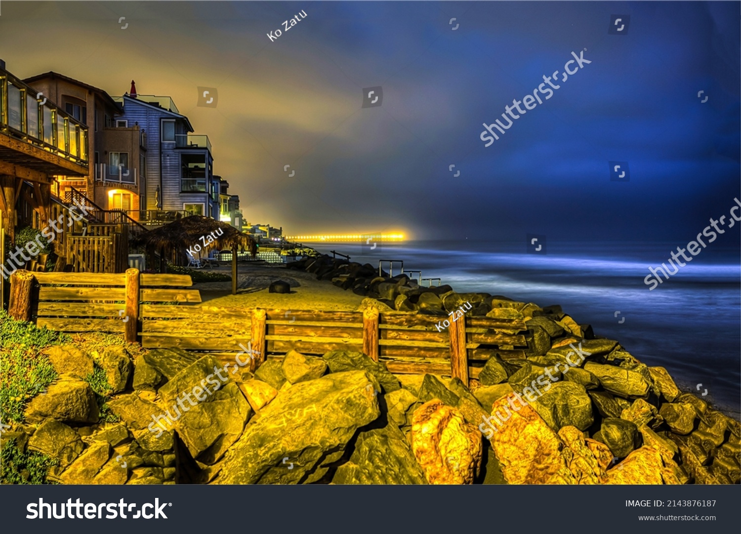 Houses on the coast in the late evening. Coastline city houses in evening time #2143876187