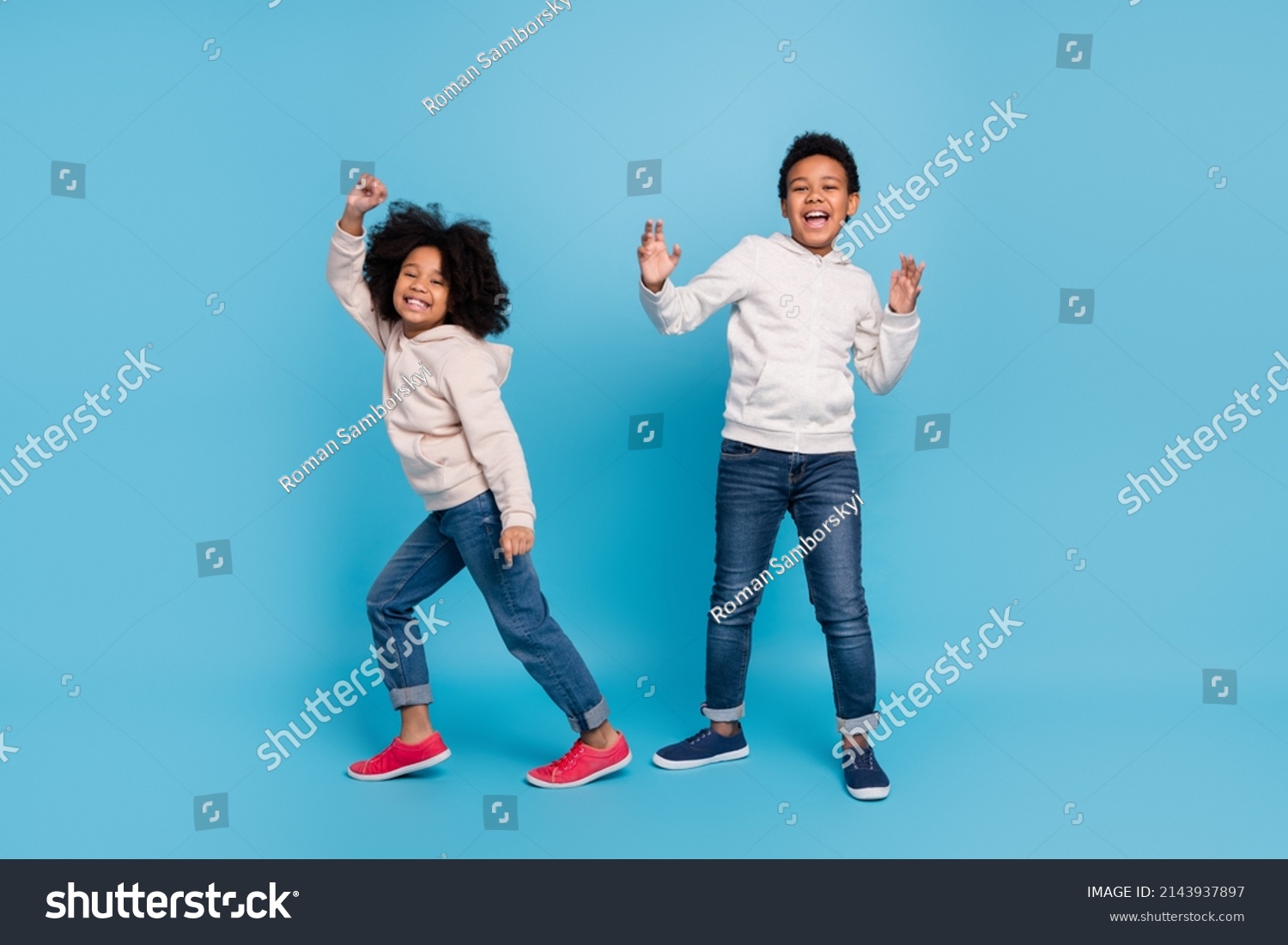 Full length body size view of attractive cheerful kids dancing moving having fun isolated over bright blue color background #2143937897
