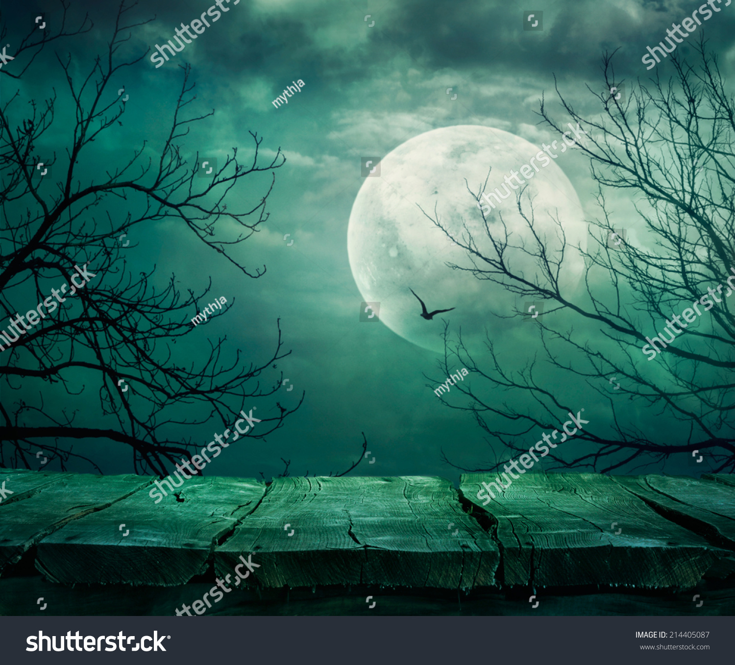 Halloween background. Spooky forest with full moon and wooden table #214405087