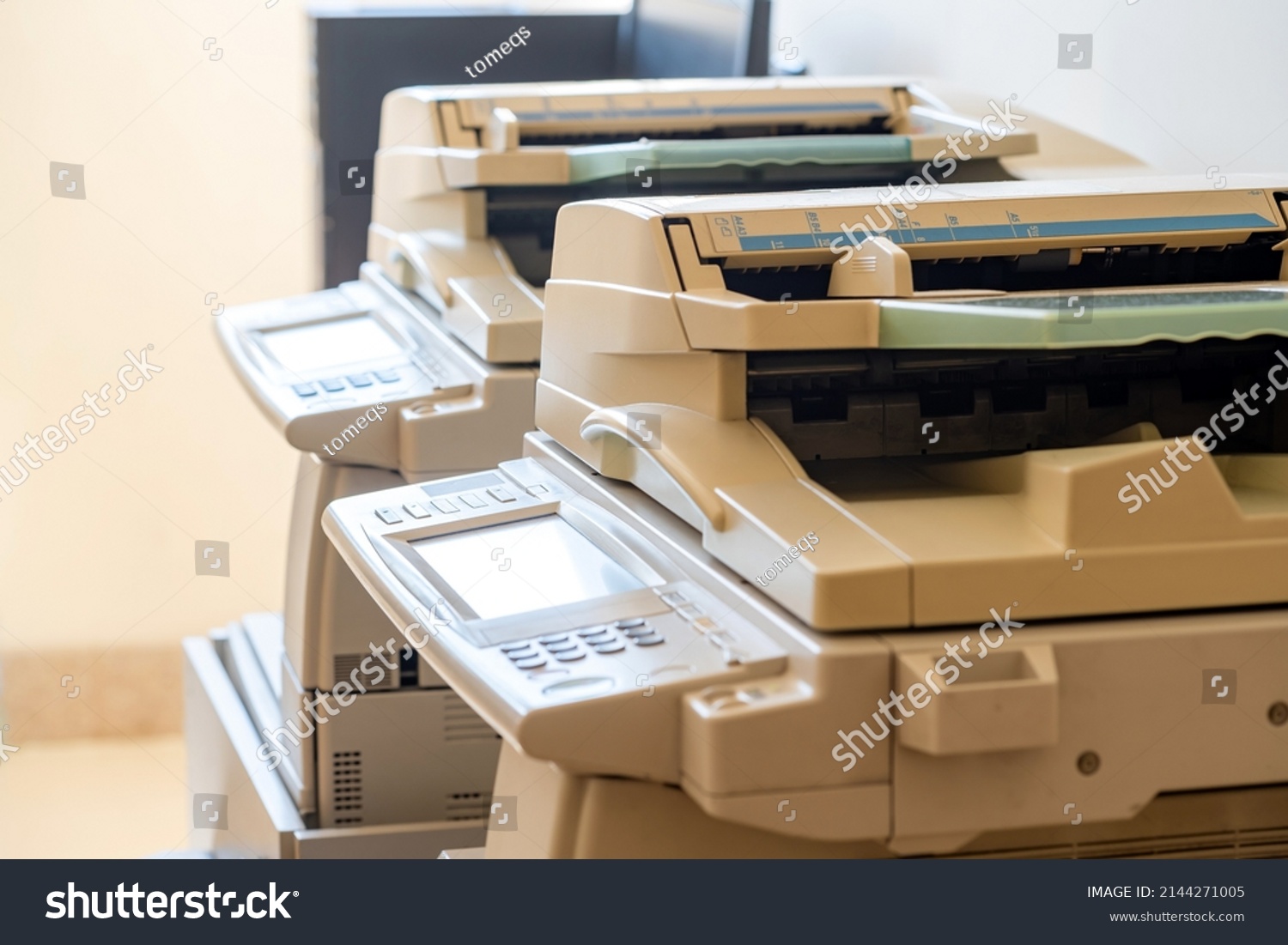 Copy shop copiers, photocopying point interior, two photocopiers copy machines objects closeup, detail, nobody. Photocopy archiving, scanning copying documents technology abstract concept, no people #2144271005