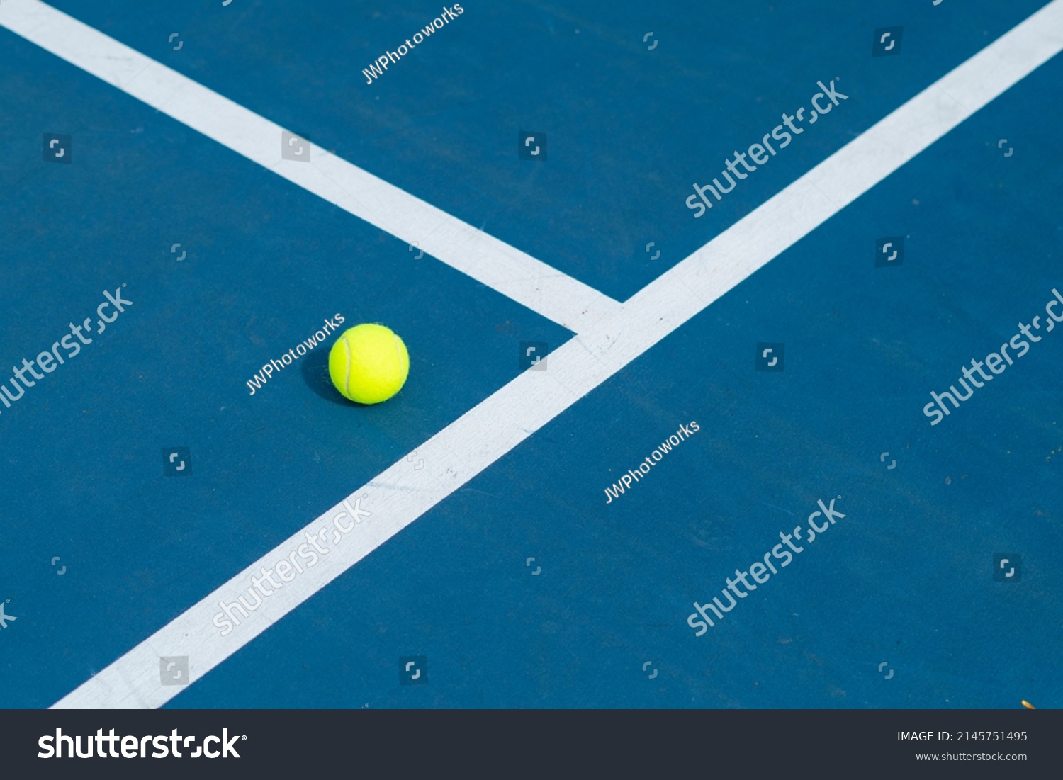A Single Tennis Ball On a Tennis Court - Great Photo For Tennis or Sports Related Promotions #2145751495