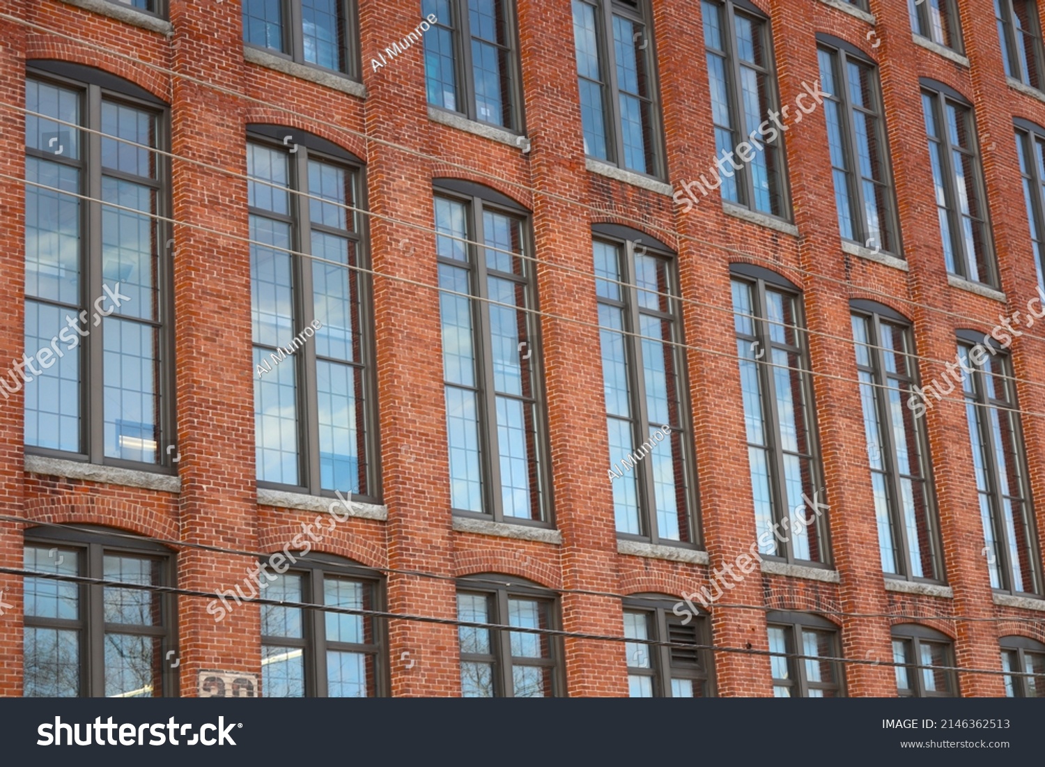 Beautiful Tall Windows spread across Old New England Mill Building: Clinton, Massachusetts #2146362513