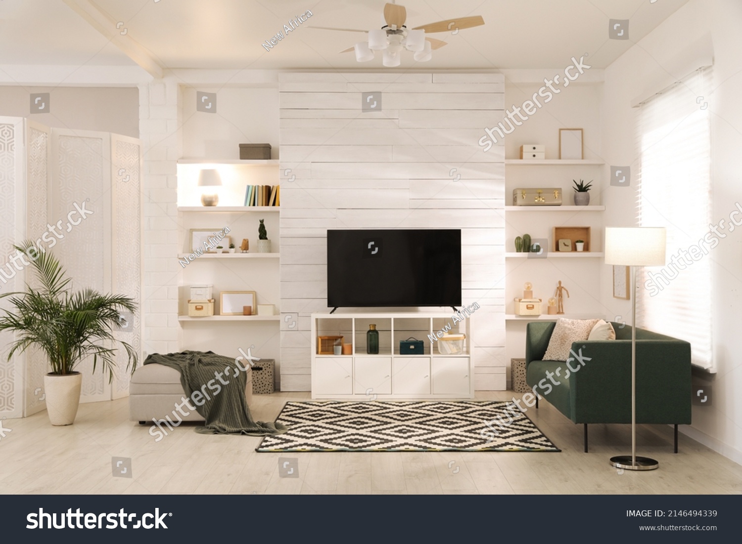 Cozy room interior with stylish furniture, decor and modern TV set #2146494339