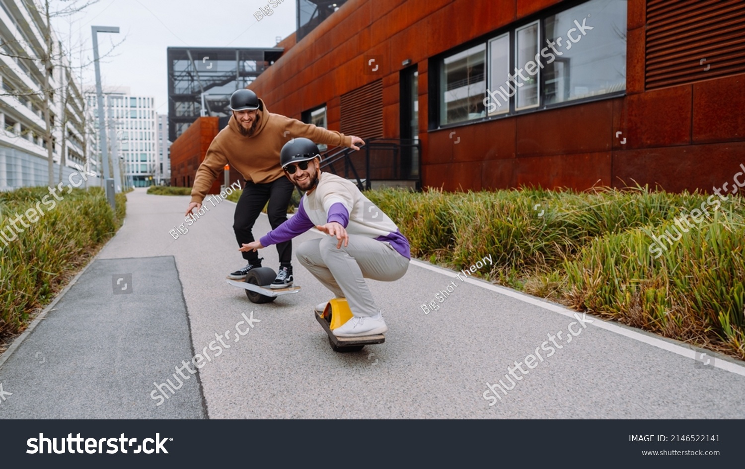 Two Men ride electric skateboards. Electric skateboard crew. the future live style #2146522141
