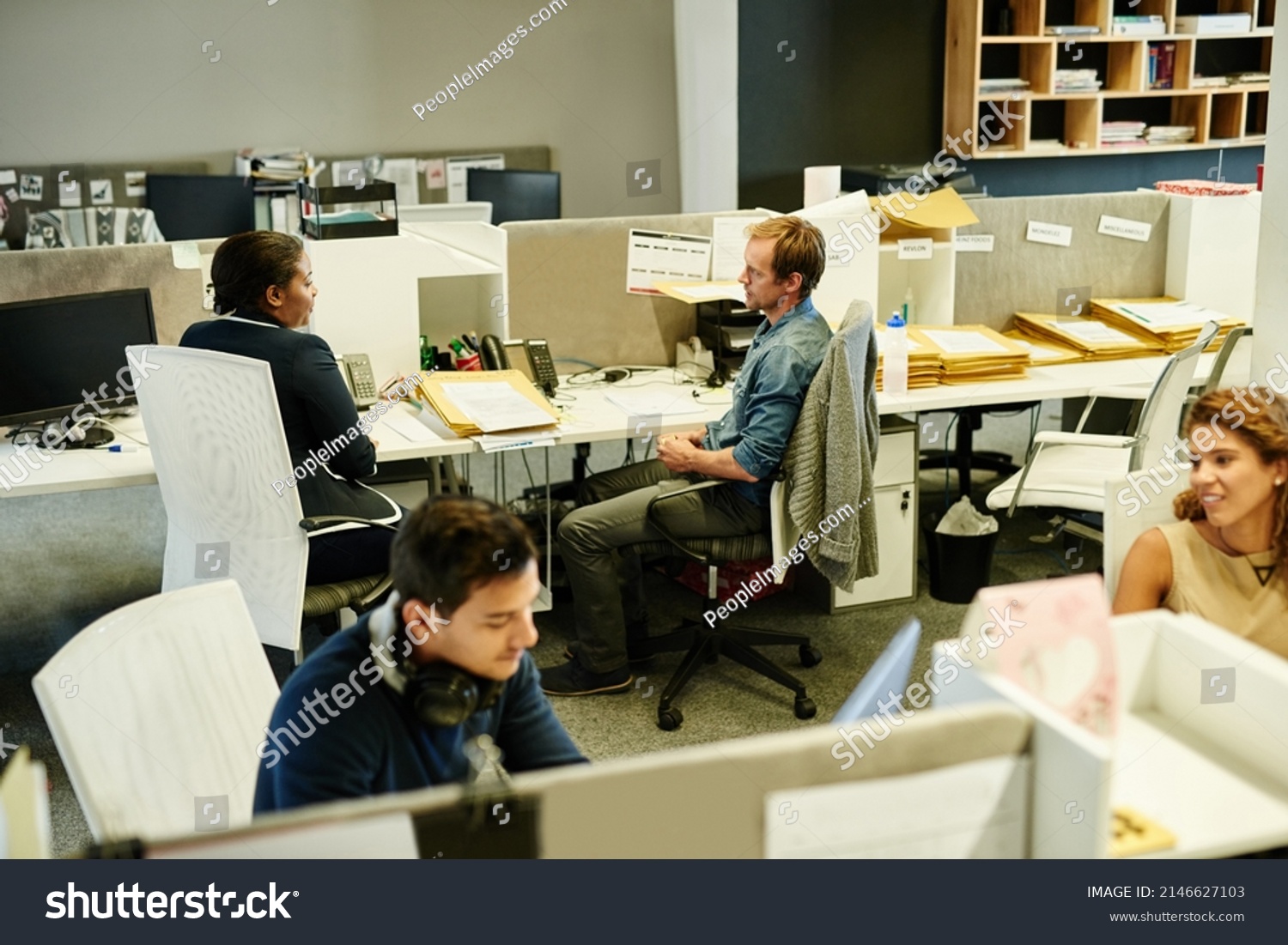 Success is a team effort. Shot of a group of colleagues working together in an office. #2146627103