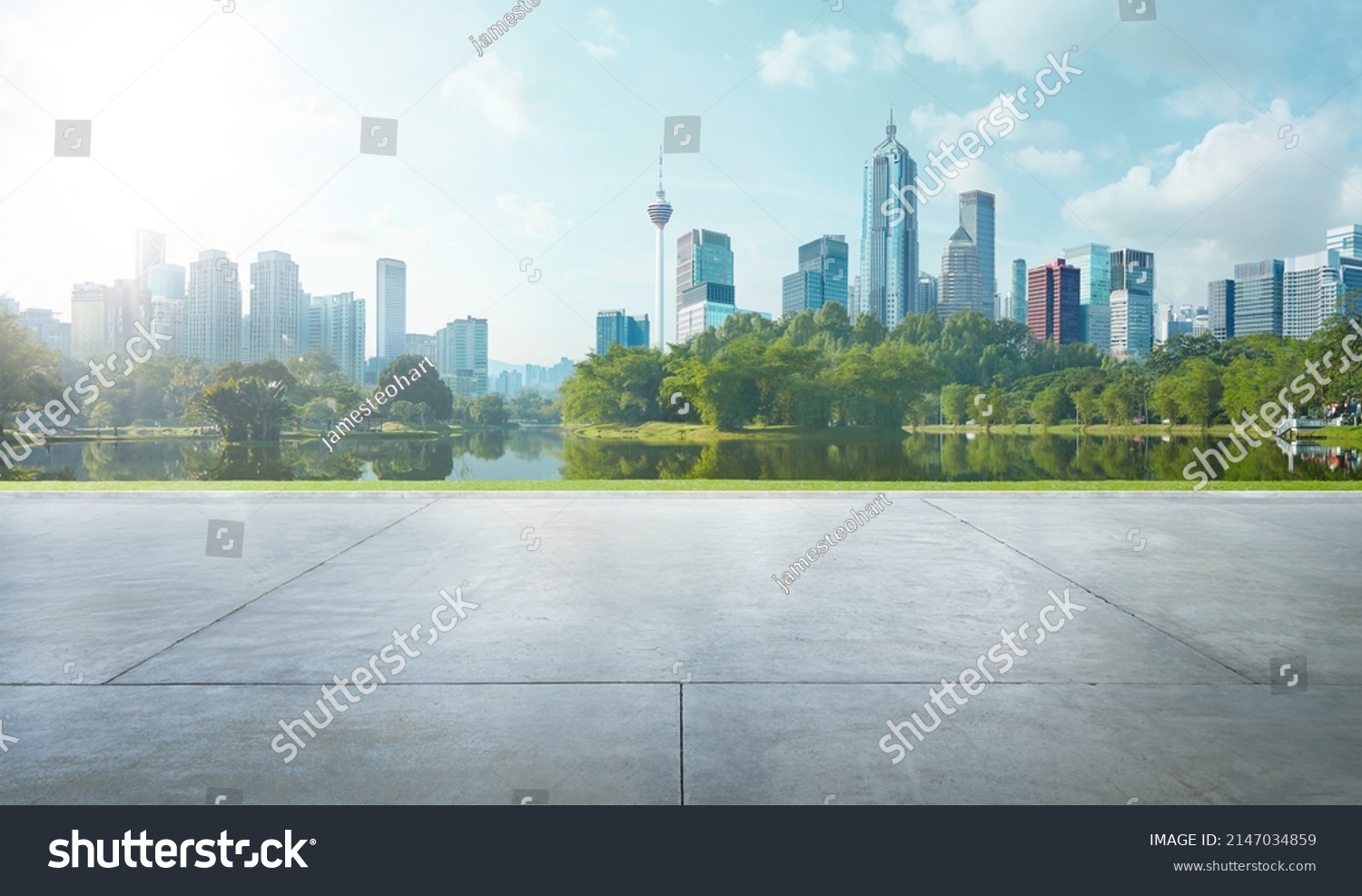 Empty cement floor with lake garden and modern city skyline in background. #2147034859