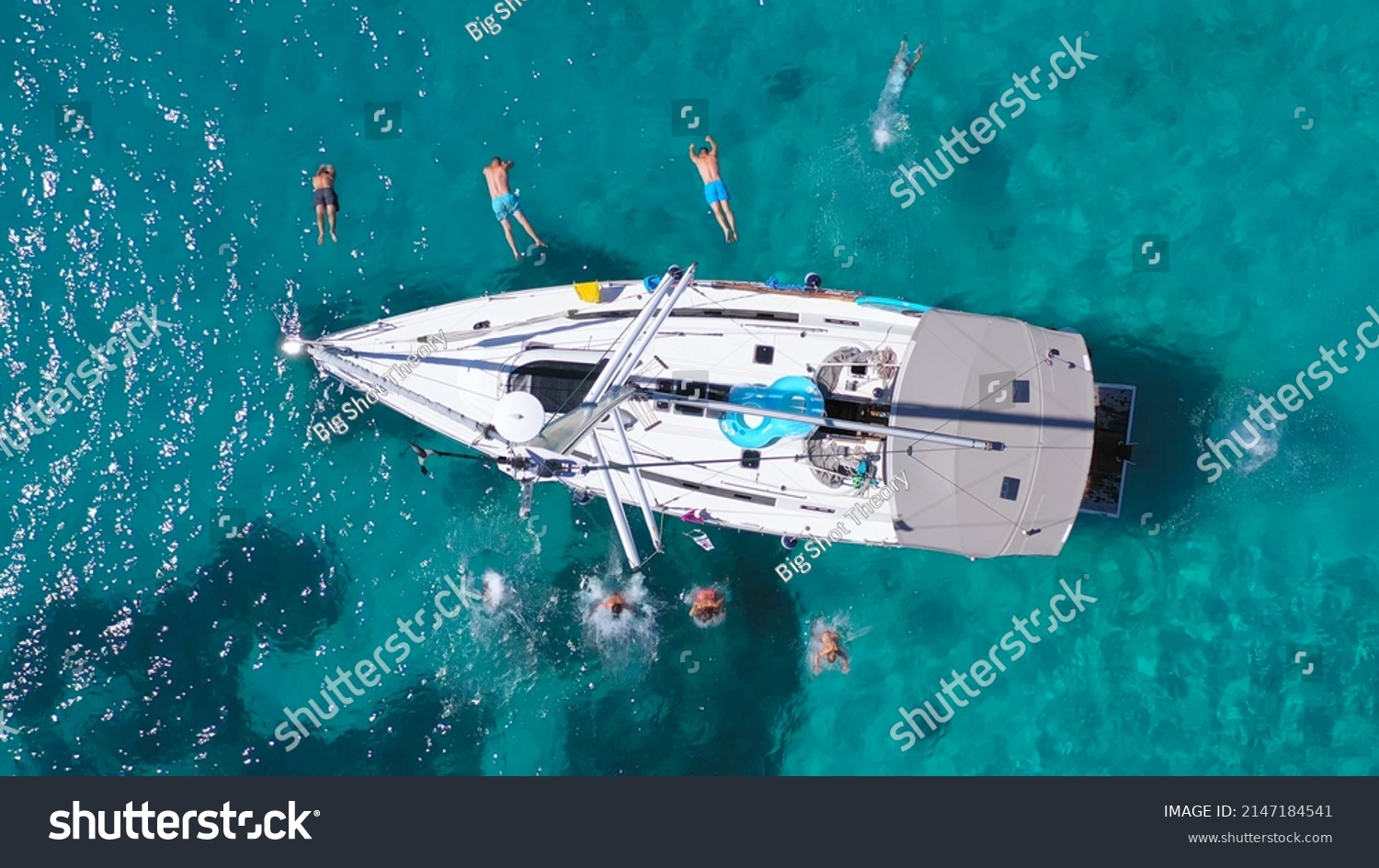 Top view of young friends jumping from sailboat. Yachting. Sail boat party day. Summer luxury boat trip #2147184541