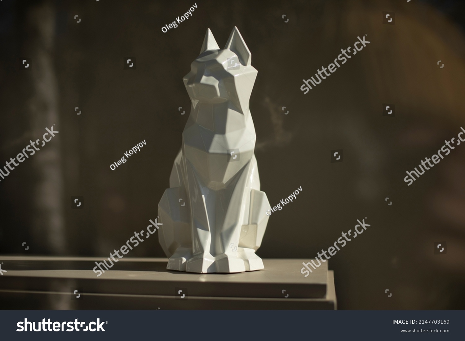 Figure of cat. Sculpture made of white plastic. Interior details. Item for decoration. #2147703169