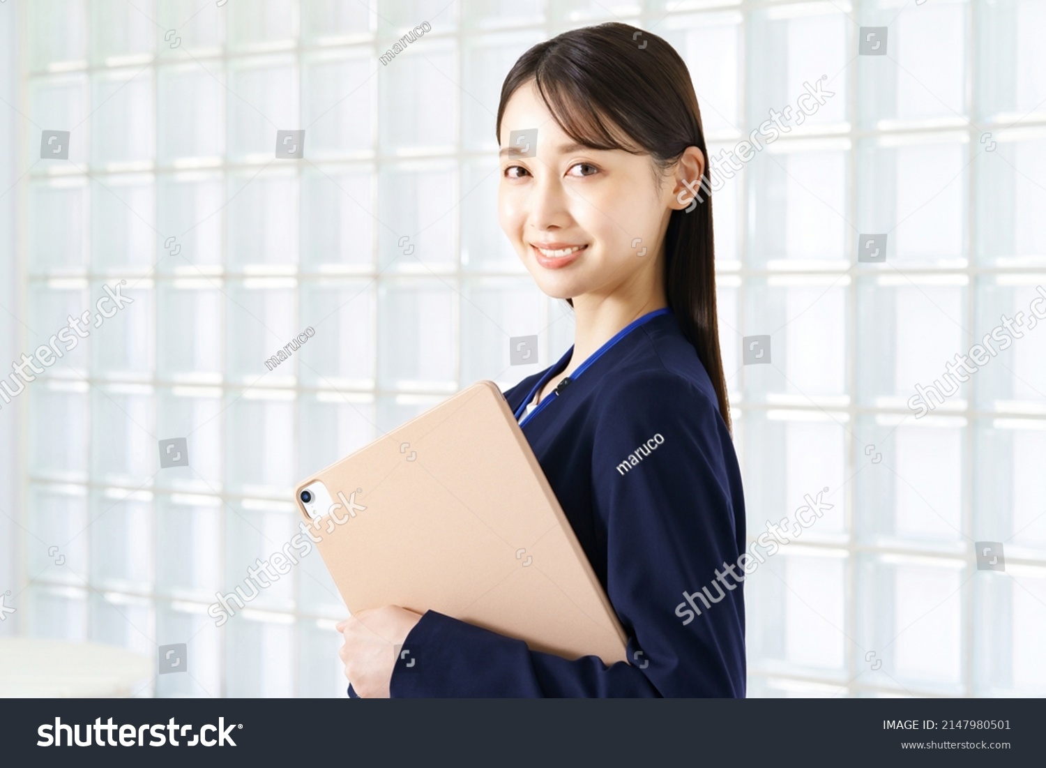Young woman in a suit #2147980501