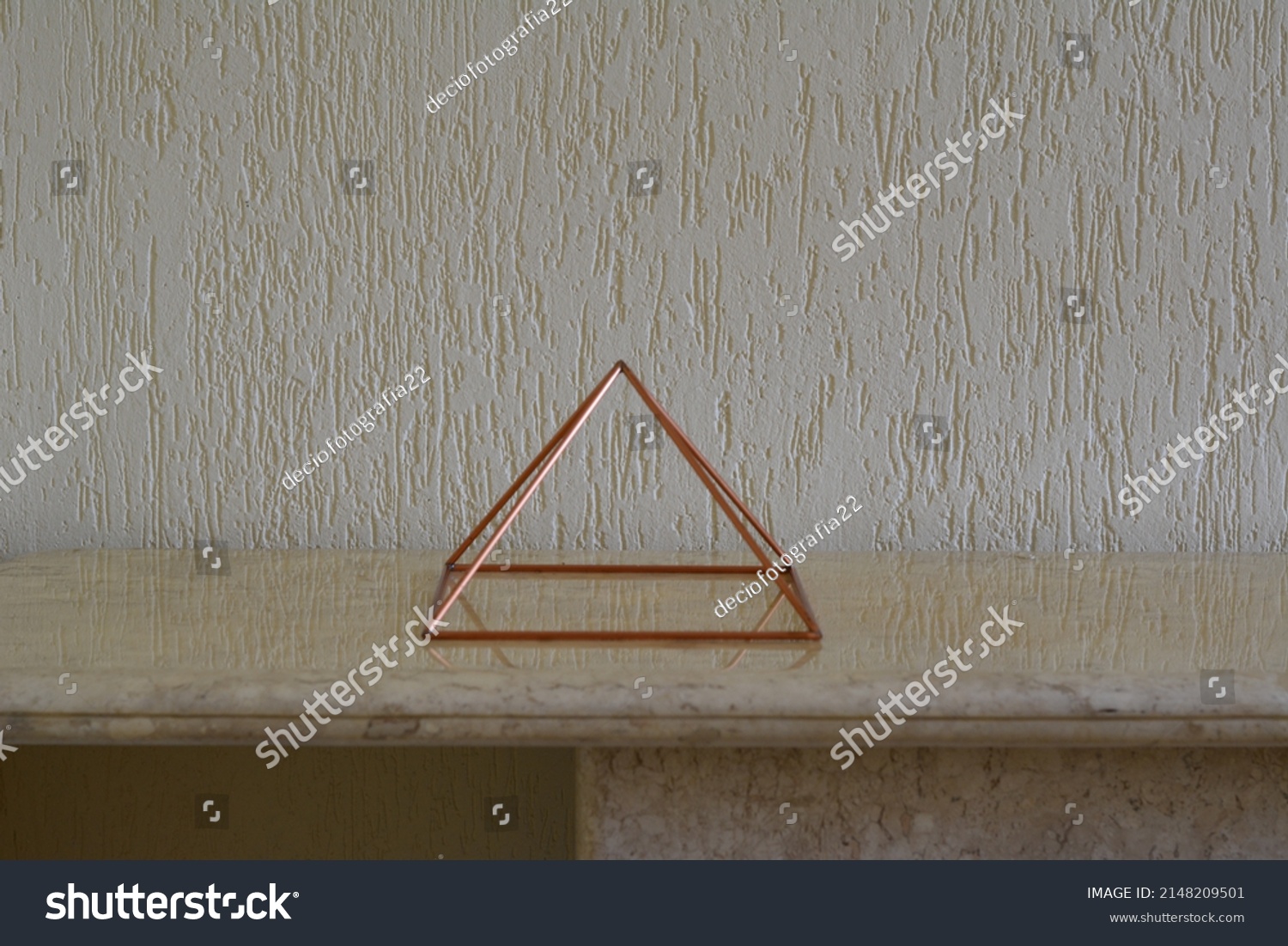 
Copper pyramid. Vazada em travertino marble table with alvenaria branca wall, Brazil, South America, graffito style wall, lateral photo #2148209501