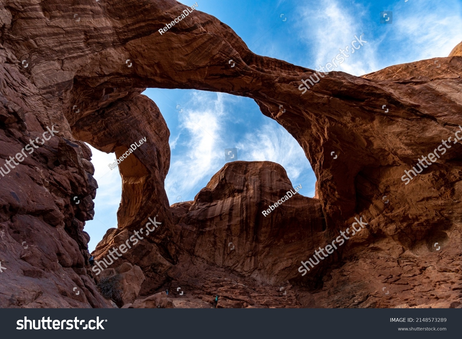 Arches National Park at Midday - Arches has many arches including the famous Delicate Arch, the Window Arch, the Double Arch and other features such as Tower of Babel, Turret Arch, and the Courthouse  #2148573289