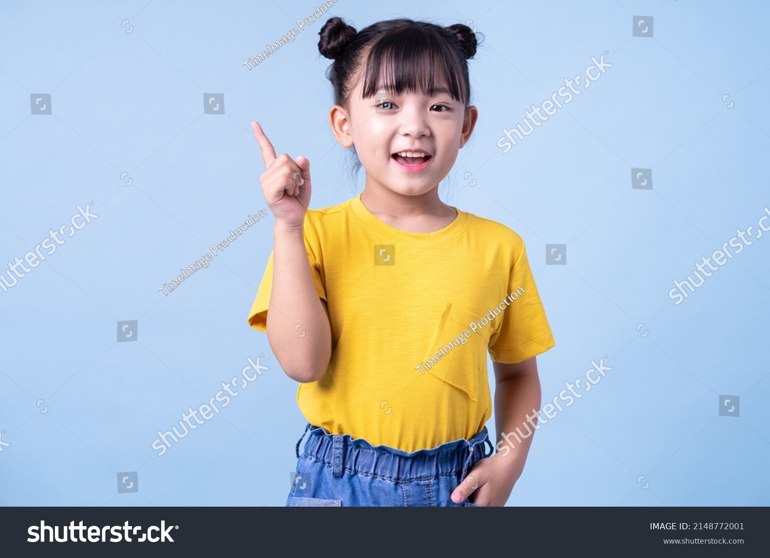 Image of Asian child posing on blue background #2148772001