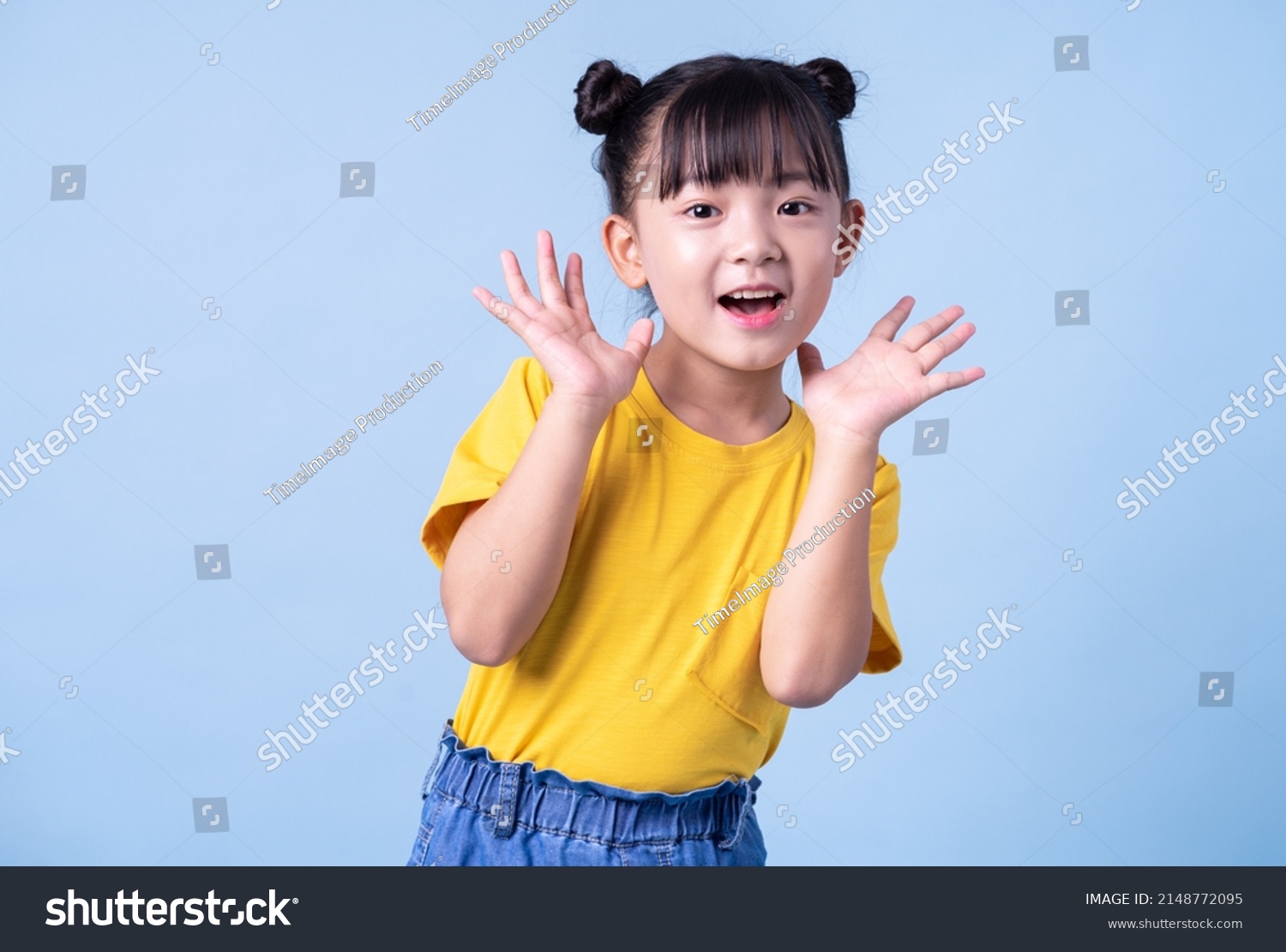 Image of Asian child posing on blue background #2148772095