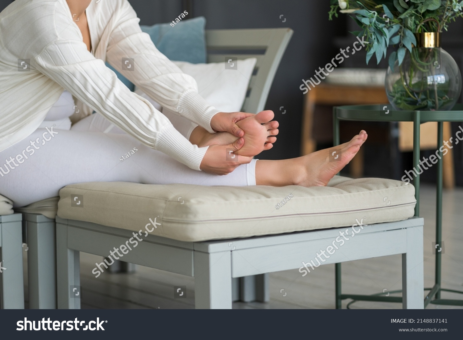 Beauty women's feet with smooth skin in the home interior, foot care and self-massage, BeH3althy concept photo #2148837141