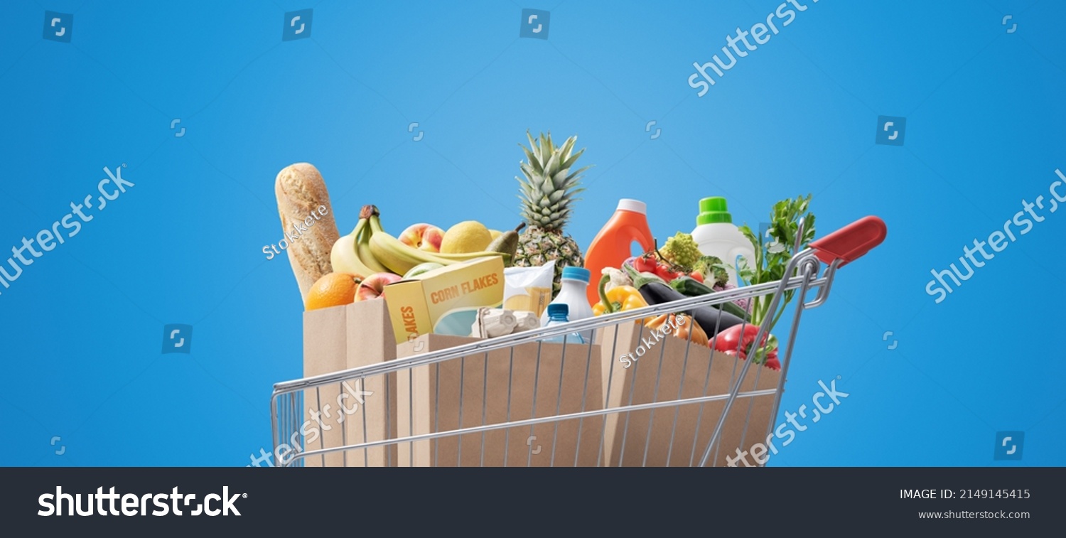 Shopping cart full of fresh groceries, grocery shopping concept #2149145415