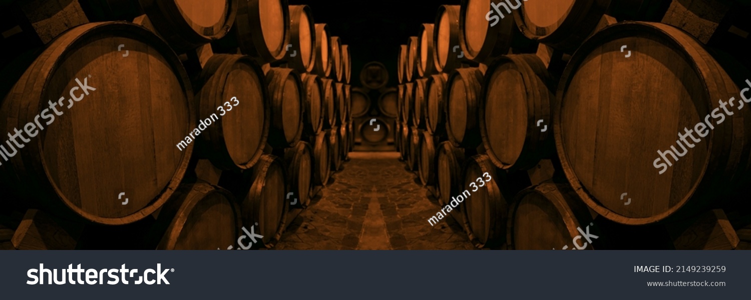 Wine or cognac barrels in the cellar of the winery, Wooden wine barrels in perspective. wine vaults. vintage oak barrels of craft beer or brandy.  #2149239259