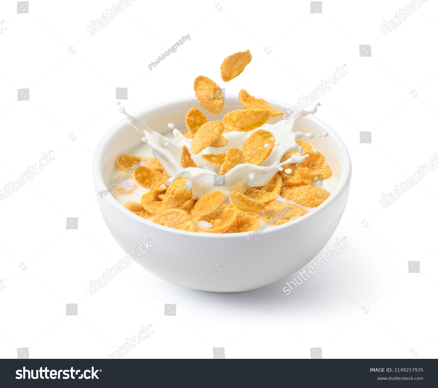 Corn flakes with milk splash in white bowl isolated on white background. #2149257935
