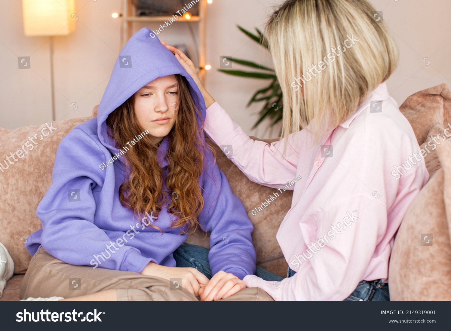 Caring Caucasian mother talk comfort unhappy sad teenage daughter suffering from school bullying or psychological problems, loving mom support make peace with depressed introvert teen girl child #2149319001