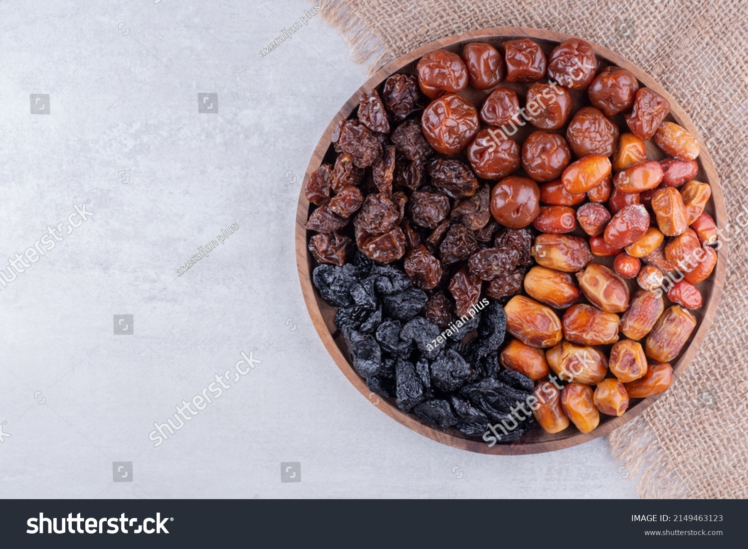 Dates or dattes palm fruit in wooden bowl is snack healthy, Set of various dates in bowl, Different kind of raw date fruit ready to eat, concrete background, Traditional, delicious and healthy ramadan #2149463123