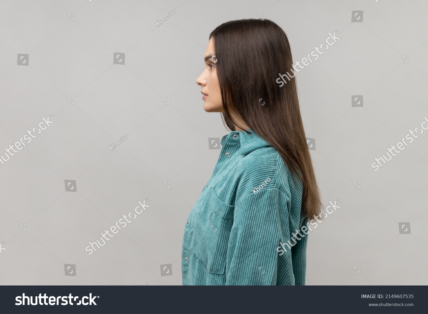 Side view of portrait of strict bossy woman looking ahead, feels confident focused self-assured, expressing seriousness, wearing casual style jacket. Indoor studio shot isolated on gray background. #2149607535