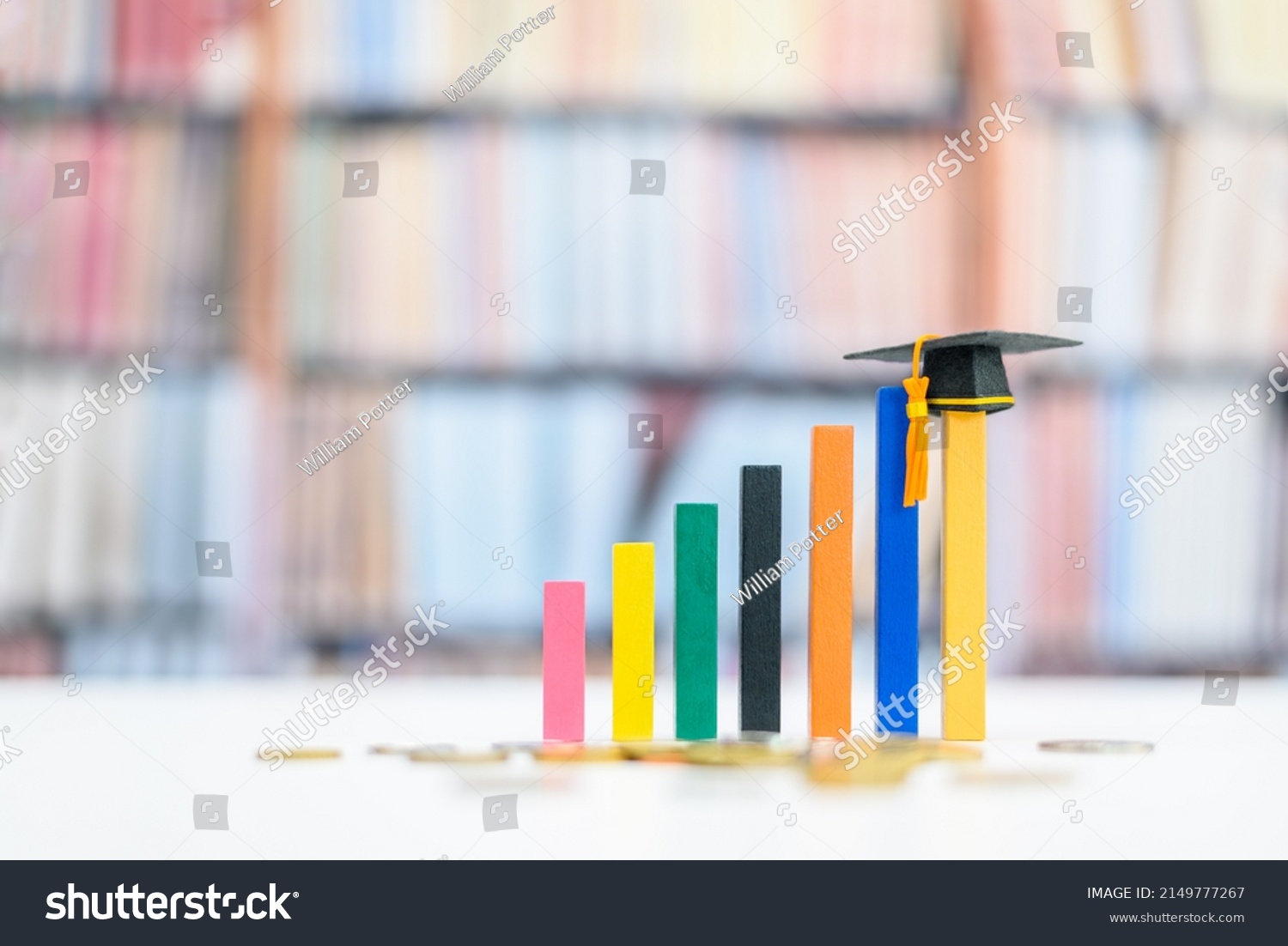 Graduate study abroad program for higher degree knowledge, education concept : Black graduation cap on increasing bar graph, depicting strong effort for students who study hard for a future career. #2149777267